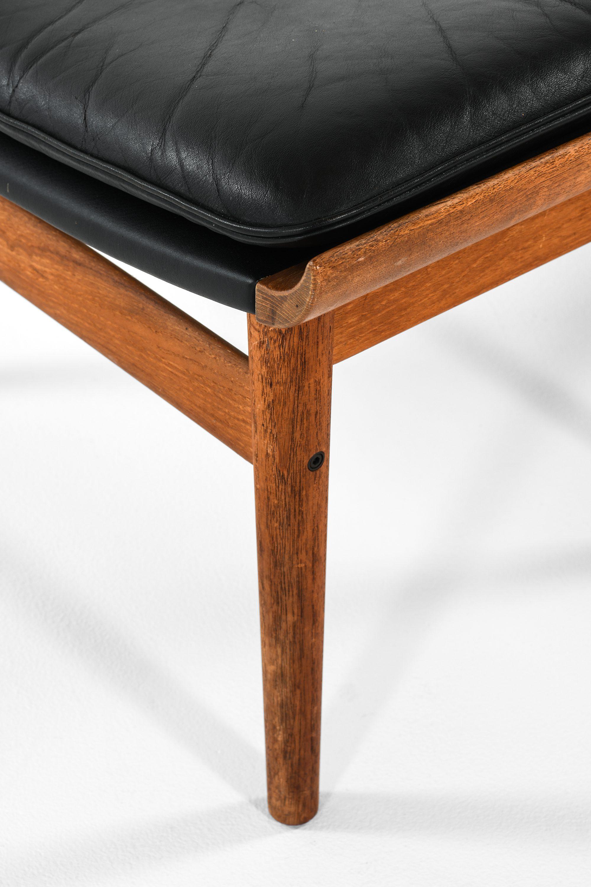 20th Century Easy Chair with Stool in Teak and Black Leather by Finn Juhl, 1960's For Sale
