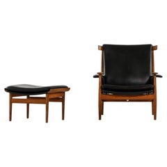 Easy Chair with Stool in Teak and Black Leather by Finn Juhl, 1960's
