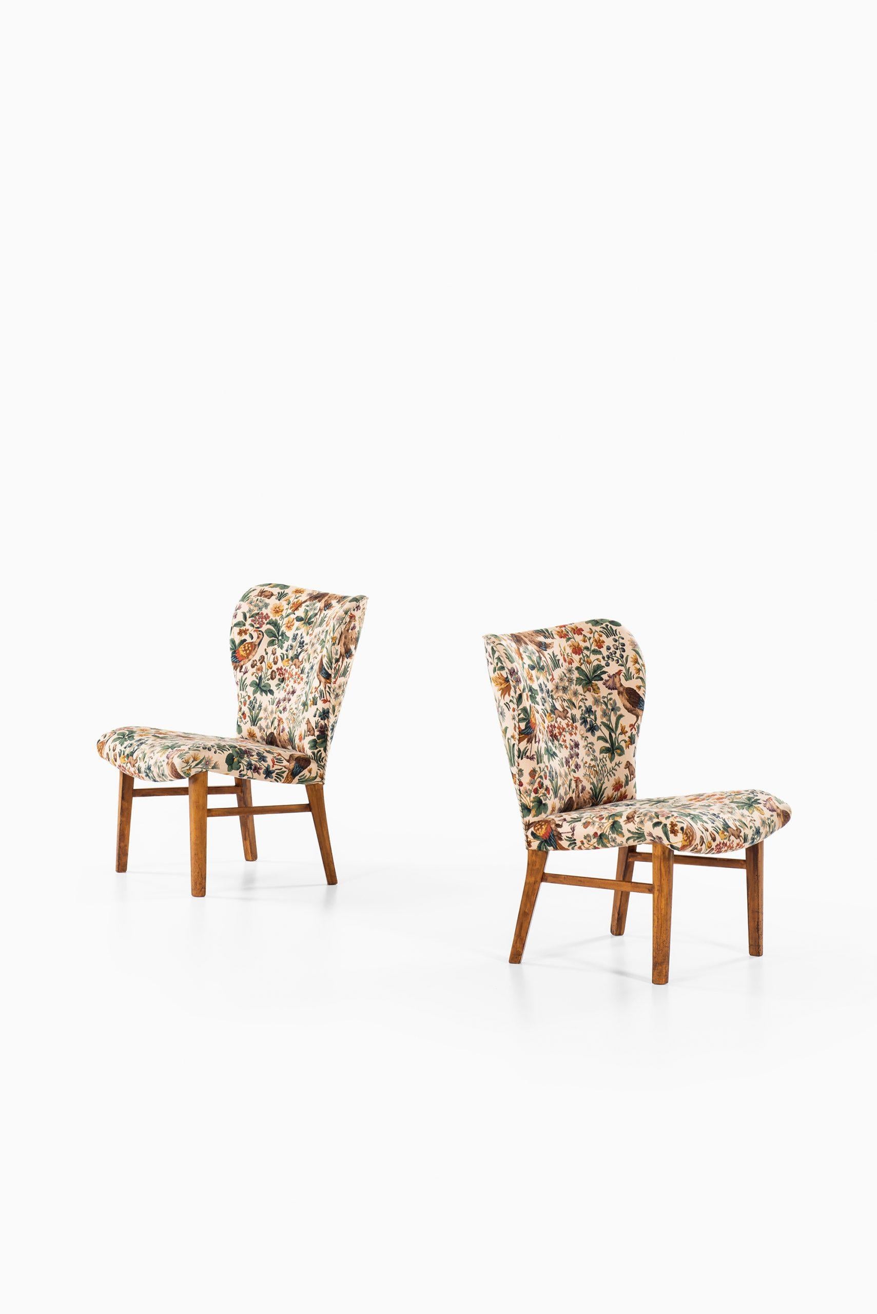 Rare pair of easy chairs attributed to Erik Bertil Karlén. Produced by Firma Rumsinteriör in Sweden.