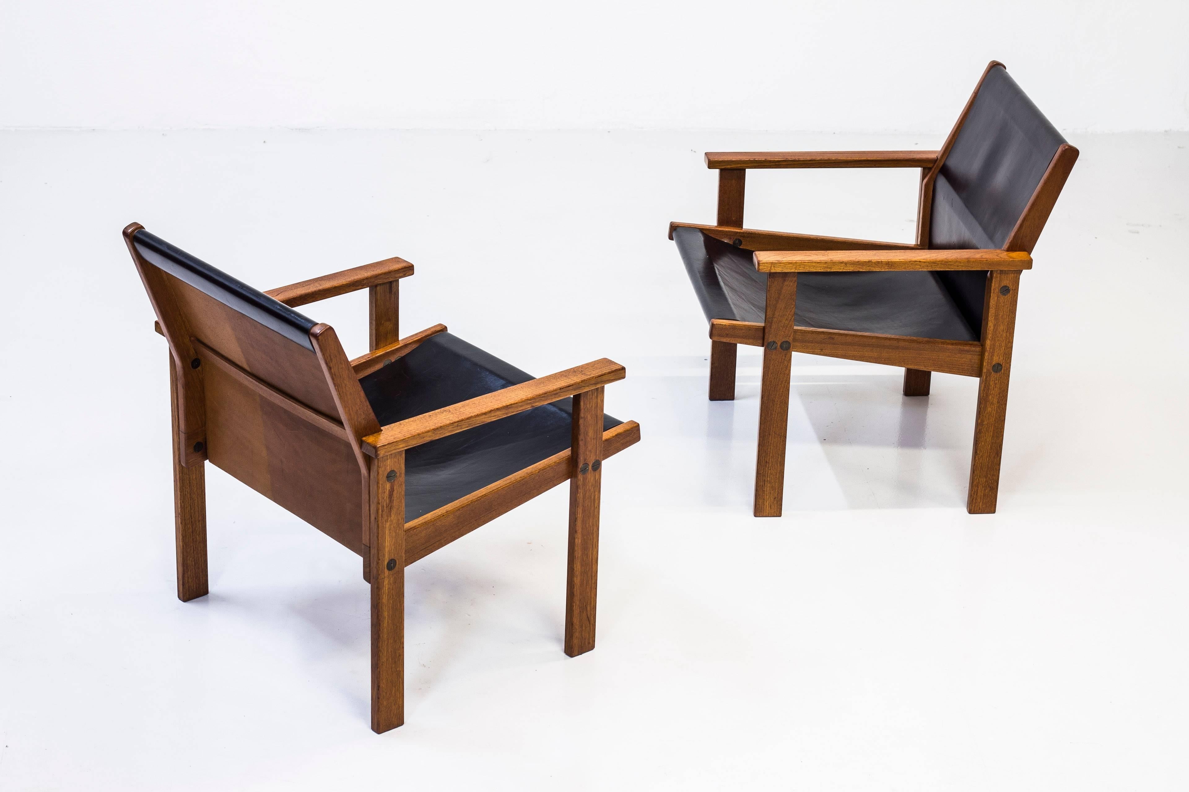Rare easy chairs designed by Hans-Agne Jakobsson. Made by Cabinetmaker Bertil Johansson in Markaryd Sweden in 1976. Made from solid teak with thick leather seat and back rest. Nice oversized custom brass hardwear. very good original condition with