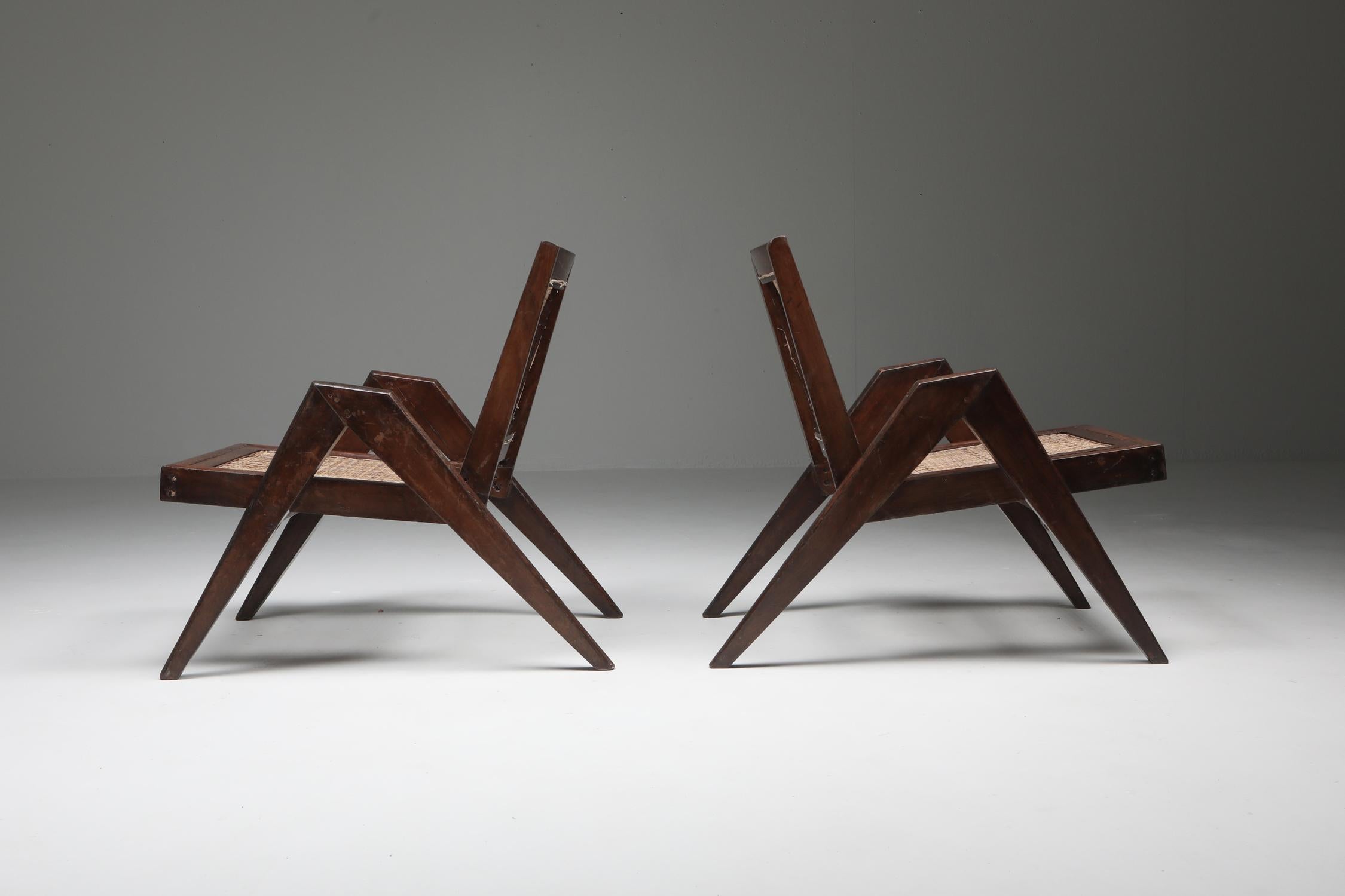 Teak low chair, a pair, Pierre Jeanneret, India 1955

Low chairs in solid teak and braided canework, Canework seat and backrest on a profiled teak structure forming a base at the back.

Designed for private residences

Another interesting and