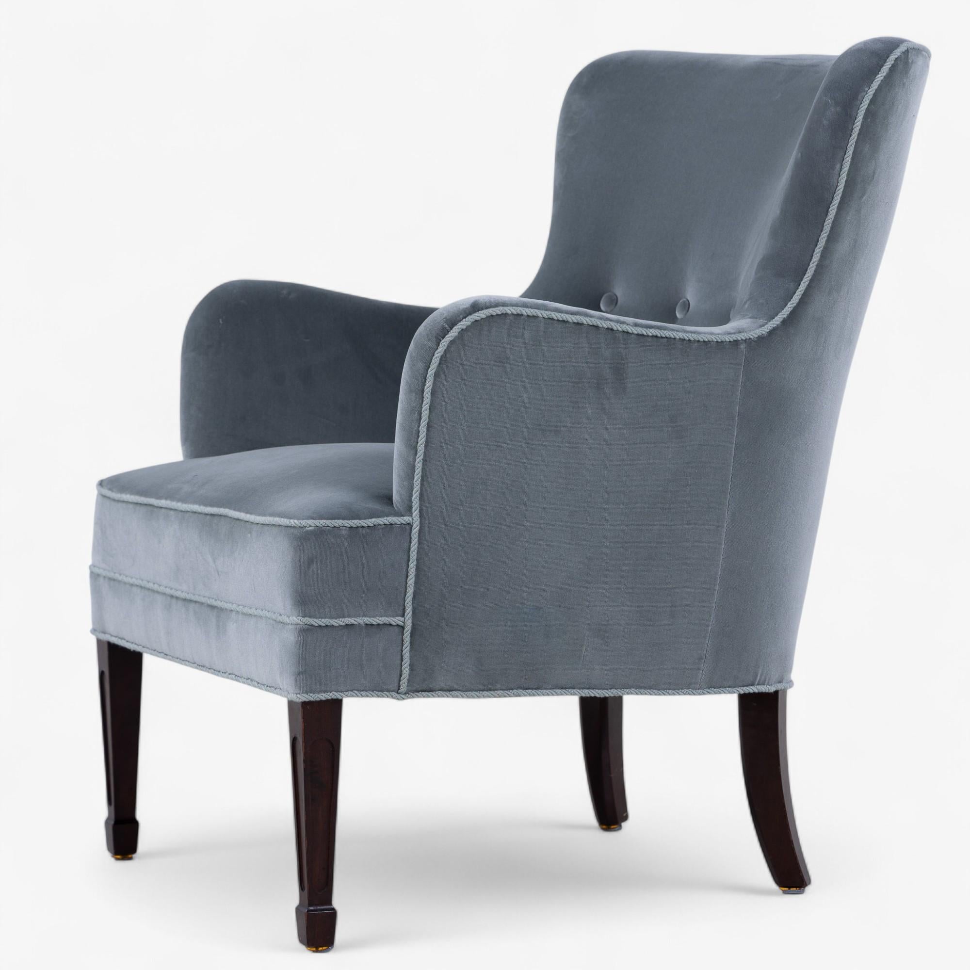 Reupholstered easy chair in 'Forenza' fabric (colour: Rosemary) and dark stained wooden legs. 1940s by Frits Henningsen.