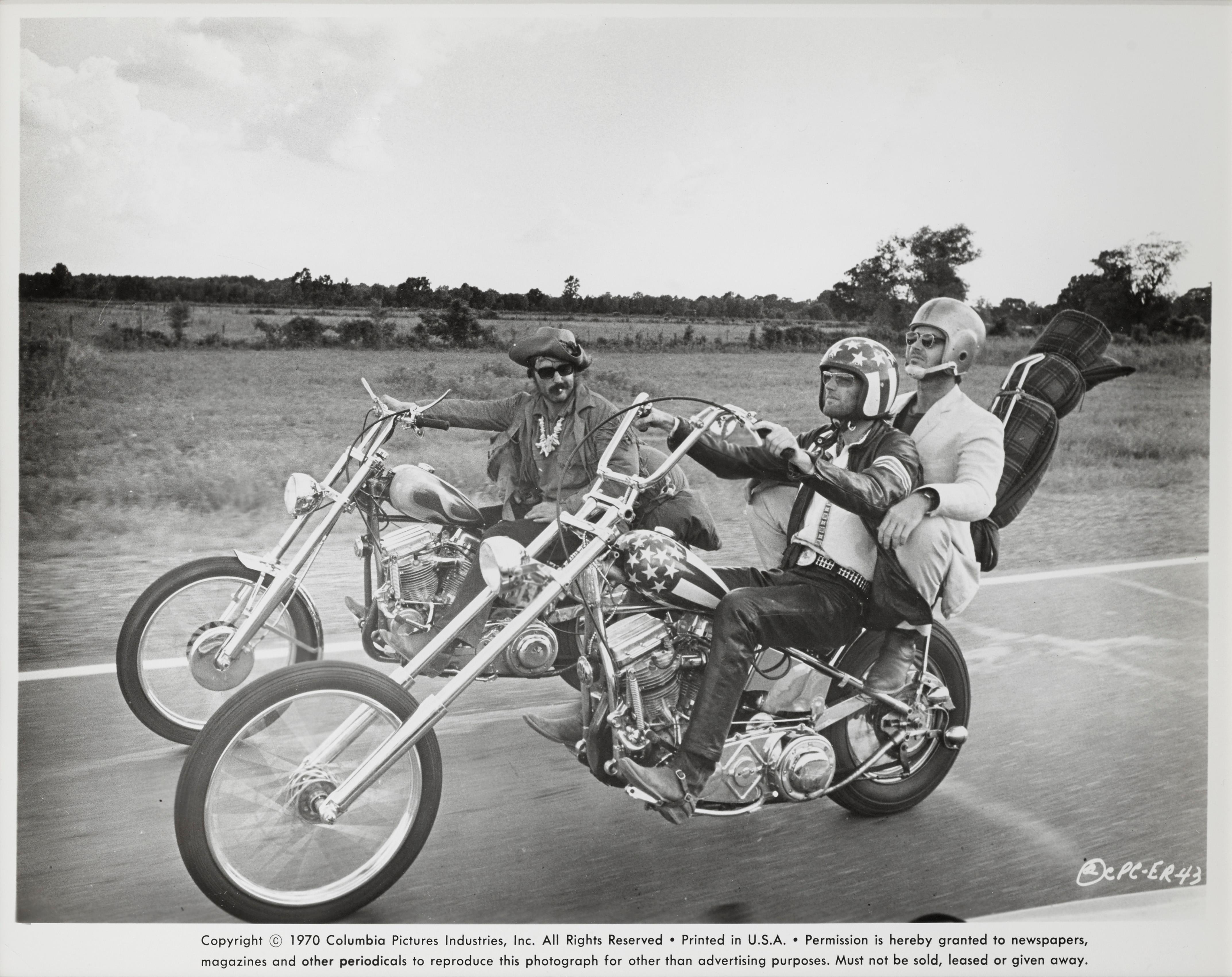 Original US framed production still for Easy Rider, 1969.
This American road movie was written by Peter Fonda, Dennis Hopper and Terry Southern. It was produced by Fonda and directed by Hopper. This is a landmark film that captured the national