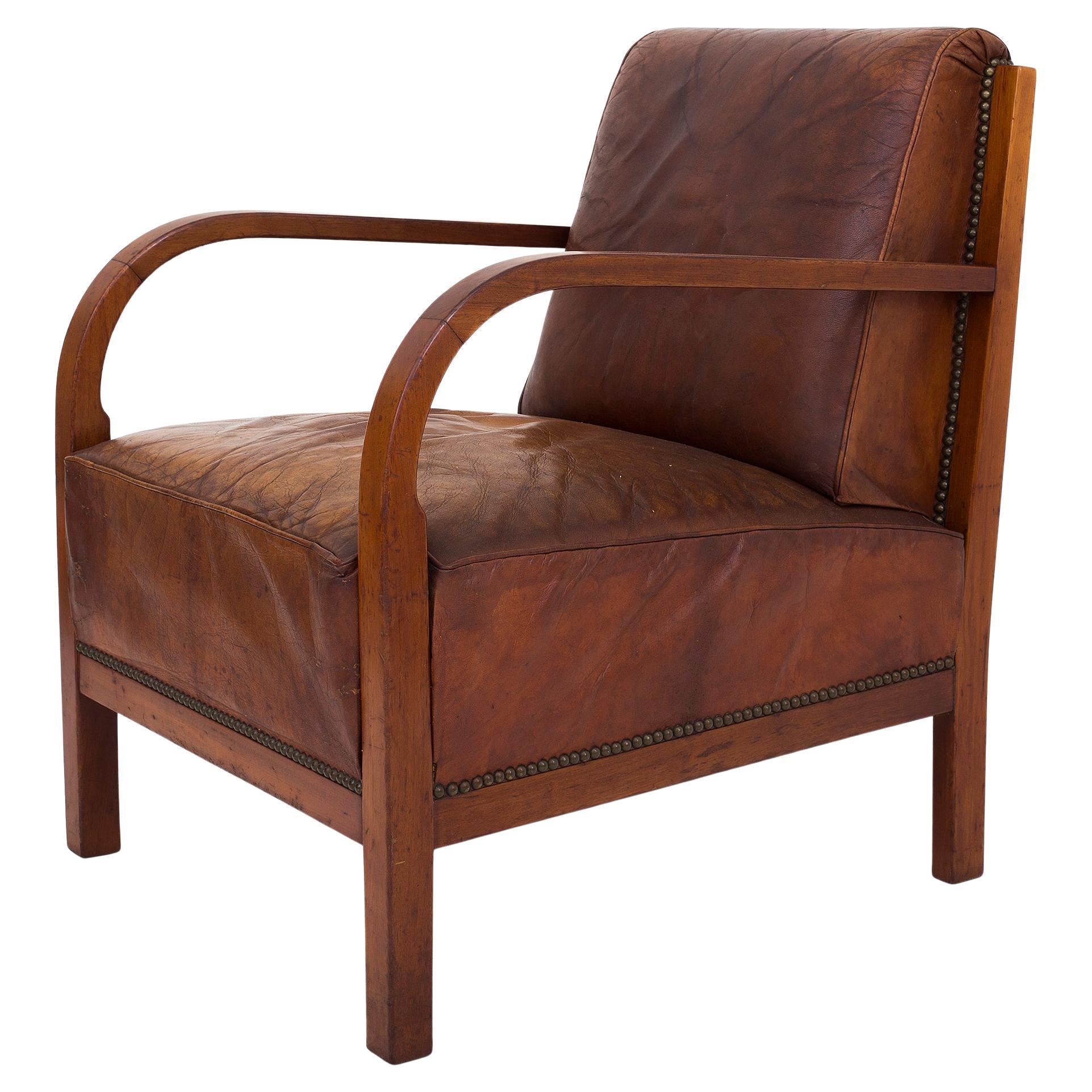 Easychair in mahogany and patinated Niger leather For Sale