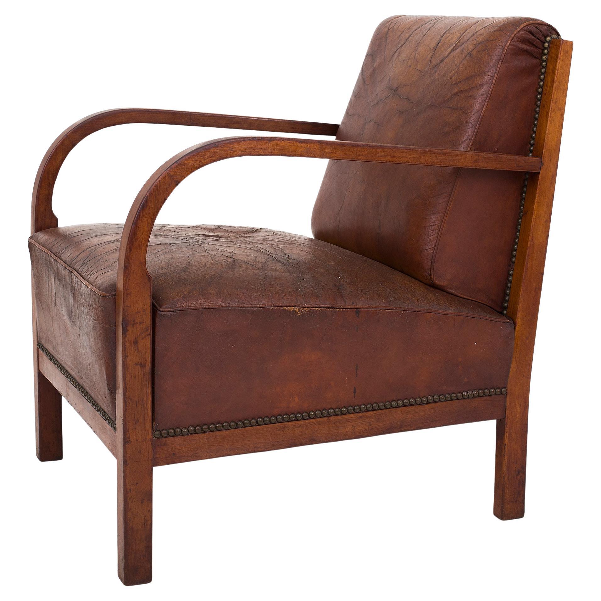 Easychair in mahogany and patinated Niger leather For Sale