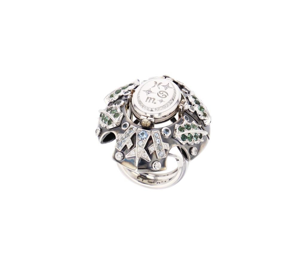 Statement white gold ring body. The silver-covered part is adorned with a decor of holly leaves consisting of a tourmaline gradient and a frosted decor made of a gradient of aquamarine and diamonds. Aquamarine and closed-crimped diamonds are also