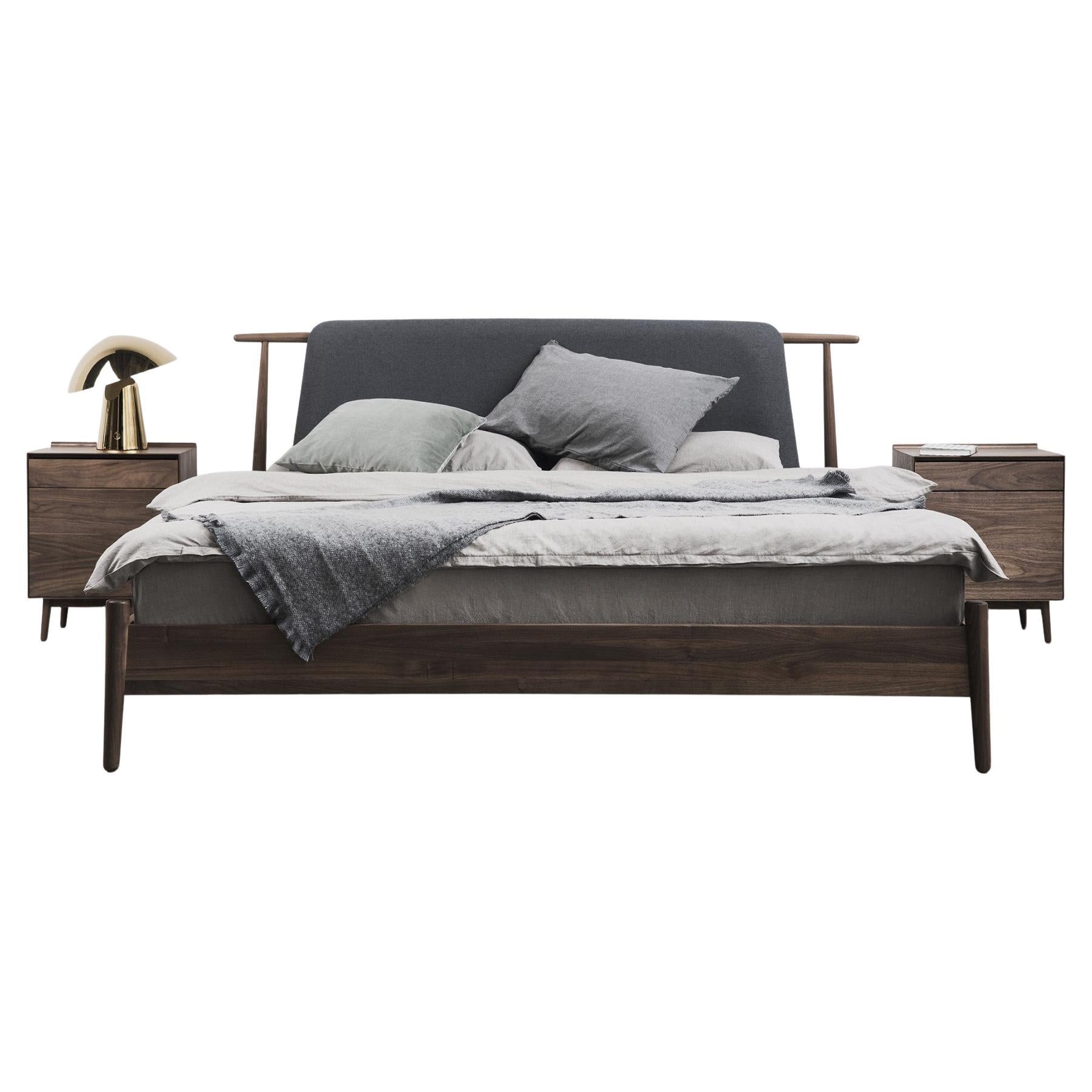 The Eaves Bed Frame takes inspiration from the graceful curves of traditional Chinese roof architecture. This sophisticated piece is crafted with the enduring strength of FAS-grade American walnut, which is further reinforced with mortise and tenon