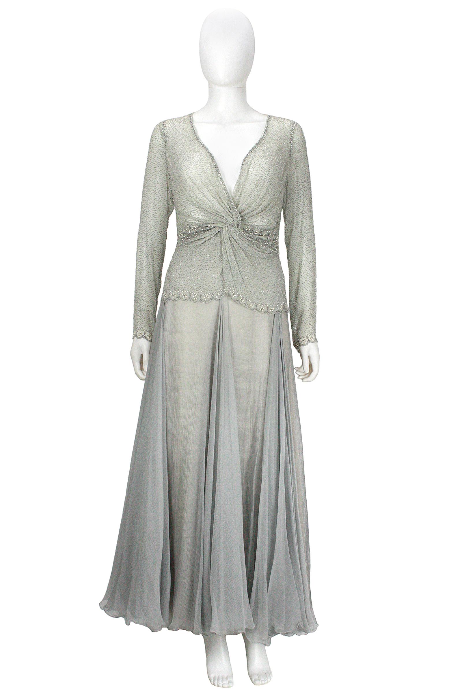 Eavis & Brown beaded top and long skirt 
Sea-foam chiffon with hand beading 
V-neck with a twist design 
Side zipper closure 
Crinkle metallic silver chiffon skirt
Champagne metallic chiffon under-layer with light grey lining 
Back zipper and hook