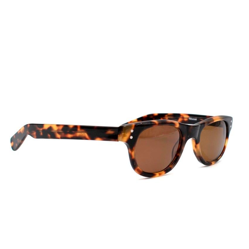 E.B. Meyrowitz Brown Tortoise Shell Sunglasses

- Tortoiseshell 
- Brown tint on lenses 

Materials:
- Acetate 
- Metal 

IT IS UNKNOWN WHERE THE SUNGLASSES WERE MADE 

Width - 14.2cm
Arm length - 15.3cm