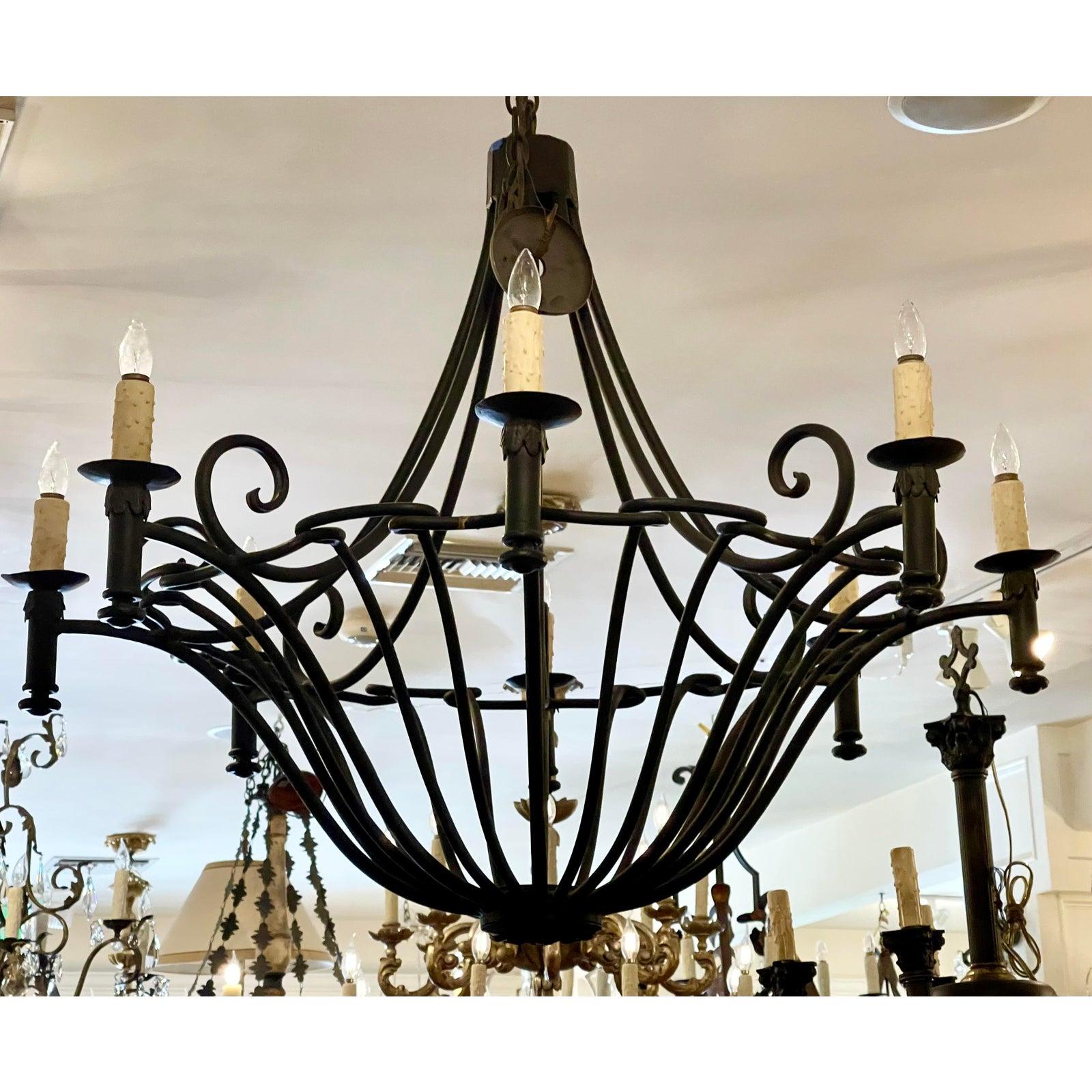 Ebanista Spanish Colonial wrought iron chandelier. Beautifully hand wrought iron and 8 lights. Includes original chain and canopy.

Provenance: From The $58M Beverly Hills Estate of Sylvester Stallone which was purchased by Adele.

Additional