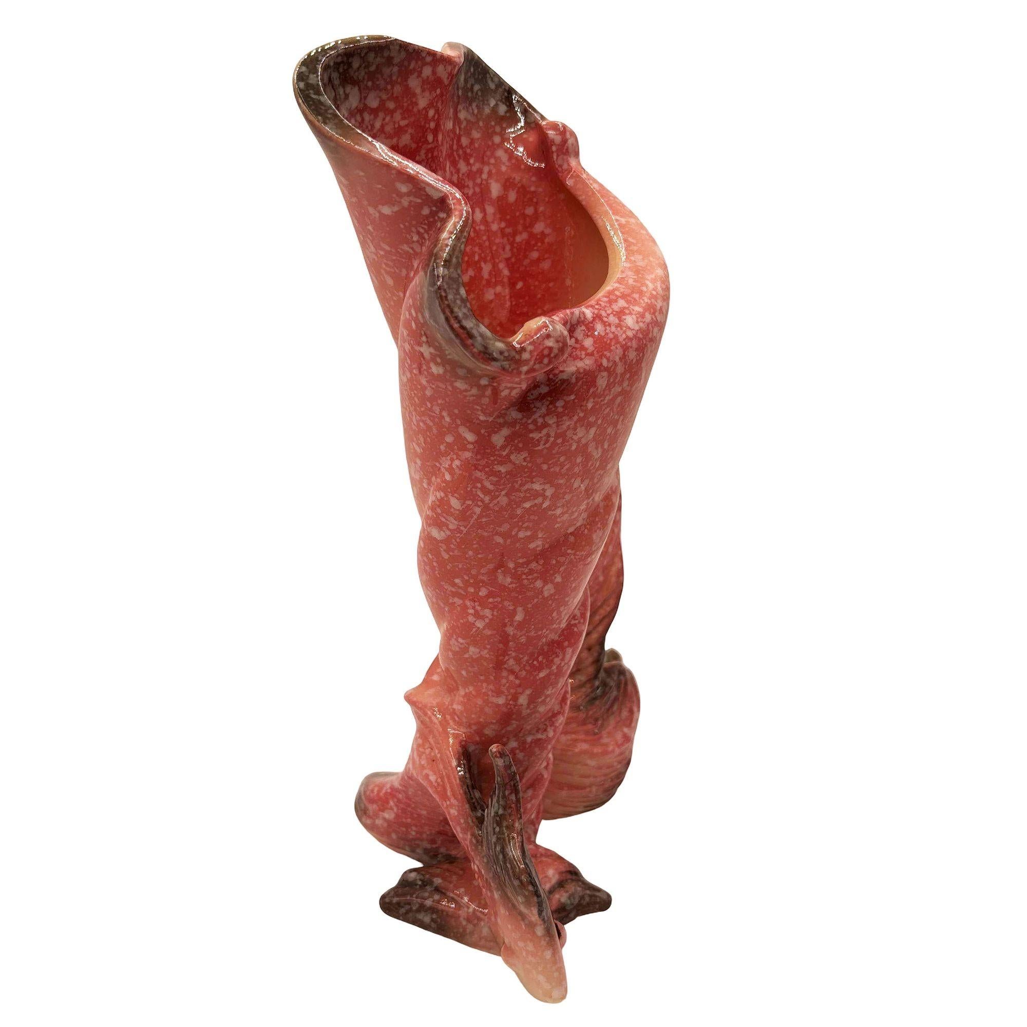 Original Mid-century Ebb Tide Vase Fish Shell Pink Speckled Ceramic by Hull Pottery. The vase features a beautifully detailed pink angel fish wrapped around a cone-shaped shell vase with white speckles. It comes in a gloss finish that highlights the