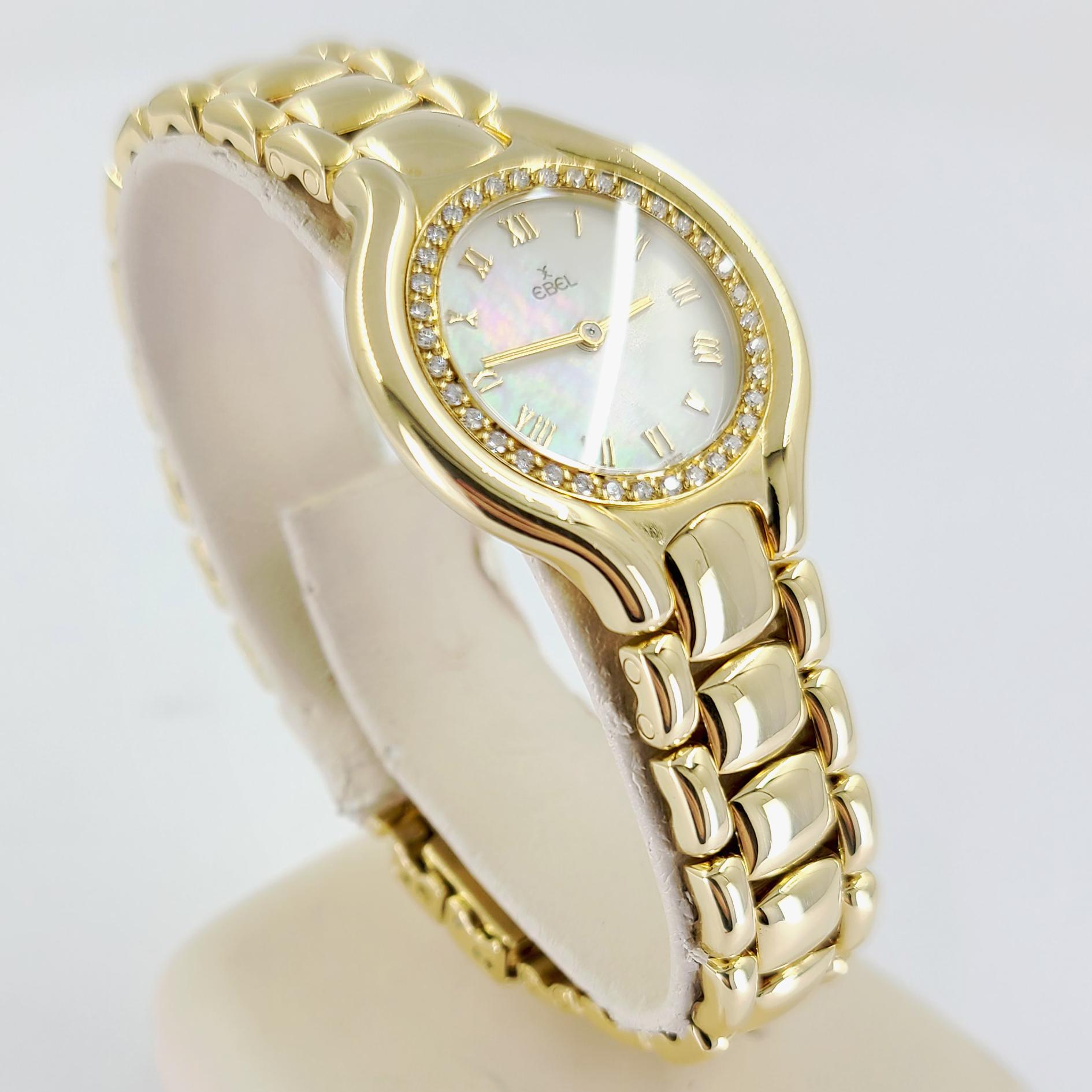 Ebel 18 Karat Gelbgold Damen-Güruga-Armbanduhr, Diamanten und Perlmutt (Rundschliff)