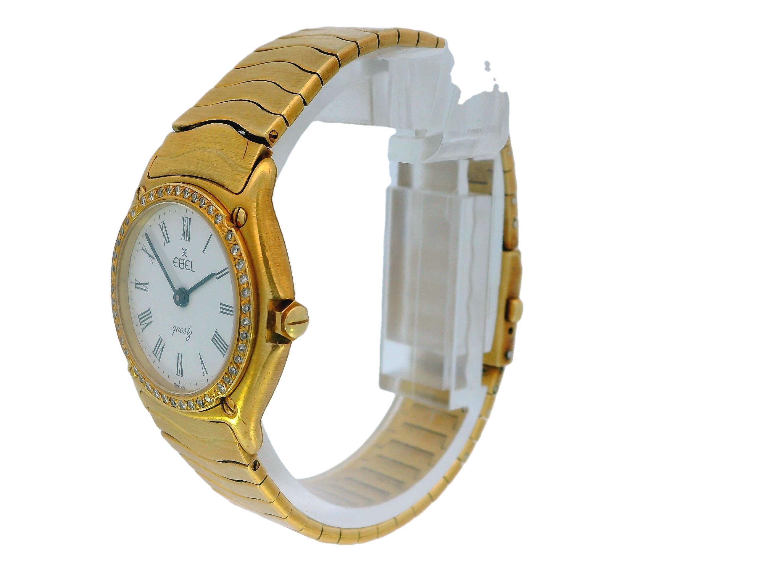 The Ebel watch is an exquisite piece crafted from 18k yellow gold, showcasing a stunning round bezel that is beautifully adorned with sparkling diamonds. The watch features a classic Roman numeral dial, complemented by striking black hands that