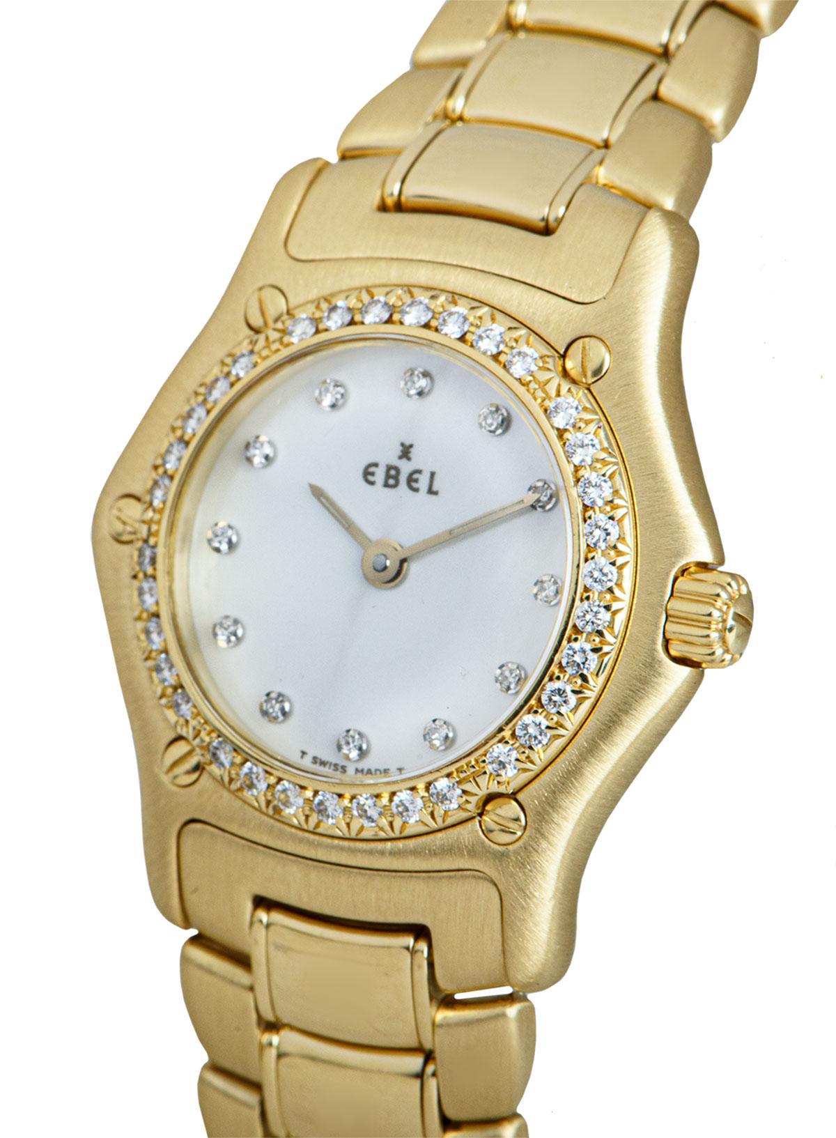 A 25 mm 18k Yellow Gold 1911 Ladies Wristwatch, white mother of pearl dial set with 12 applied round brilliant cut diamond hour markers, a fixed 18k yellow gold bezel set with 34 round brilliant cut diamonds, an 18k yellow gold bracelet with a