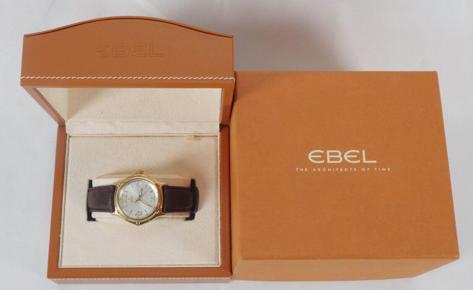 Elevate your style with the Ebel 1911 Ref: 8187241 Swiss made wristwatch. This luxury timepiece boasts a solid 18k yellow gold case with a polished finish and a white dial featuring Roman numerals and primes. The watch is powered by a Swiss made
