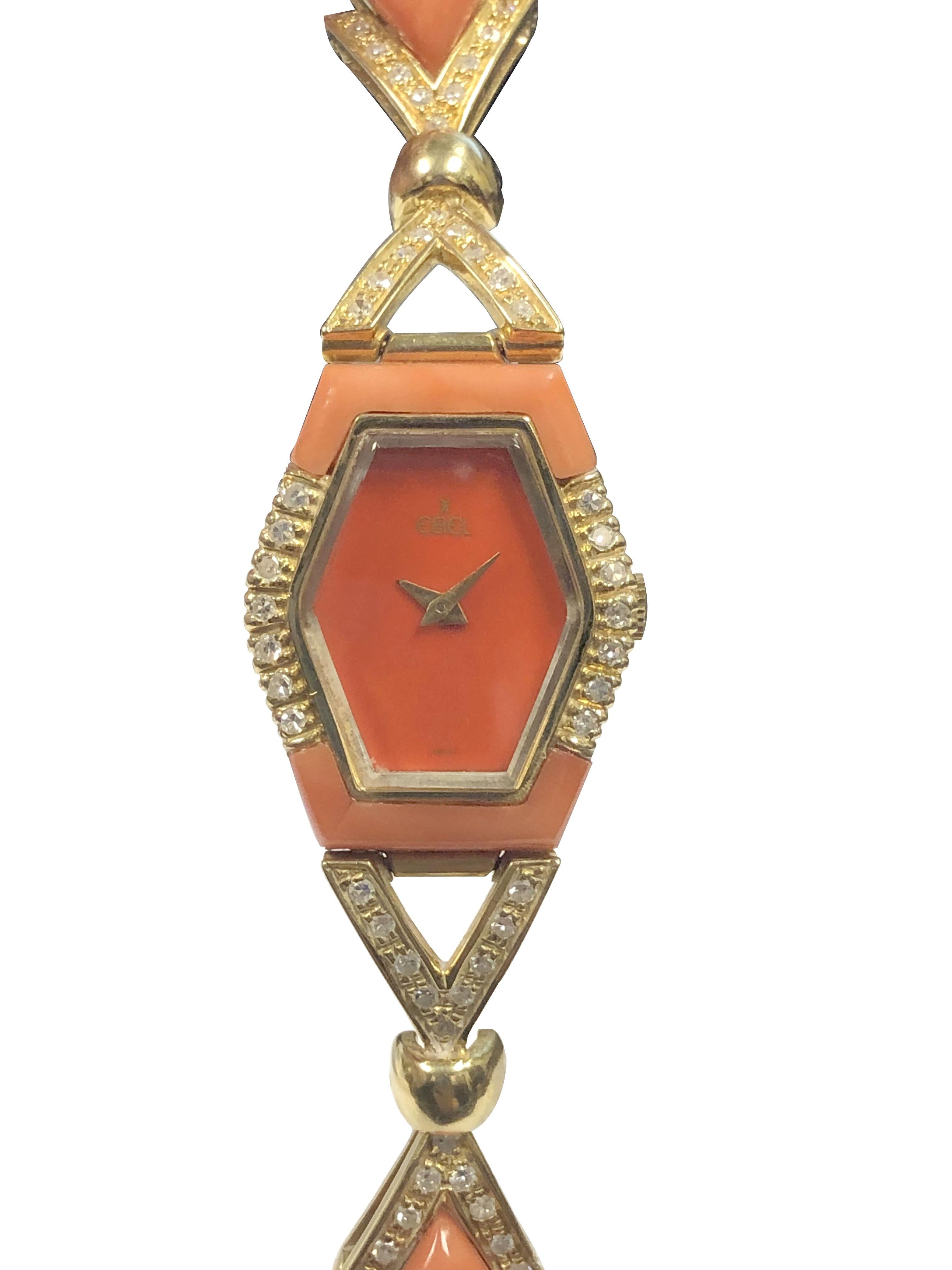 Circa 1970s Ebel Ladies Bracelet Wrist Watch, 27 X 23 M.M. 18K Yellow Gold case, 17 Jewel mechanical, manual wind movement, Coral dial with Gold hands, 5/8 inch wide 18K Yellow Gold Bracelet set with thick pieces of Orange - Red Coral and further