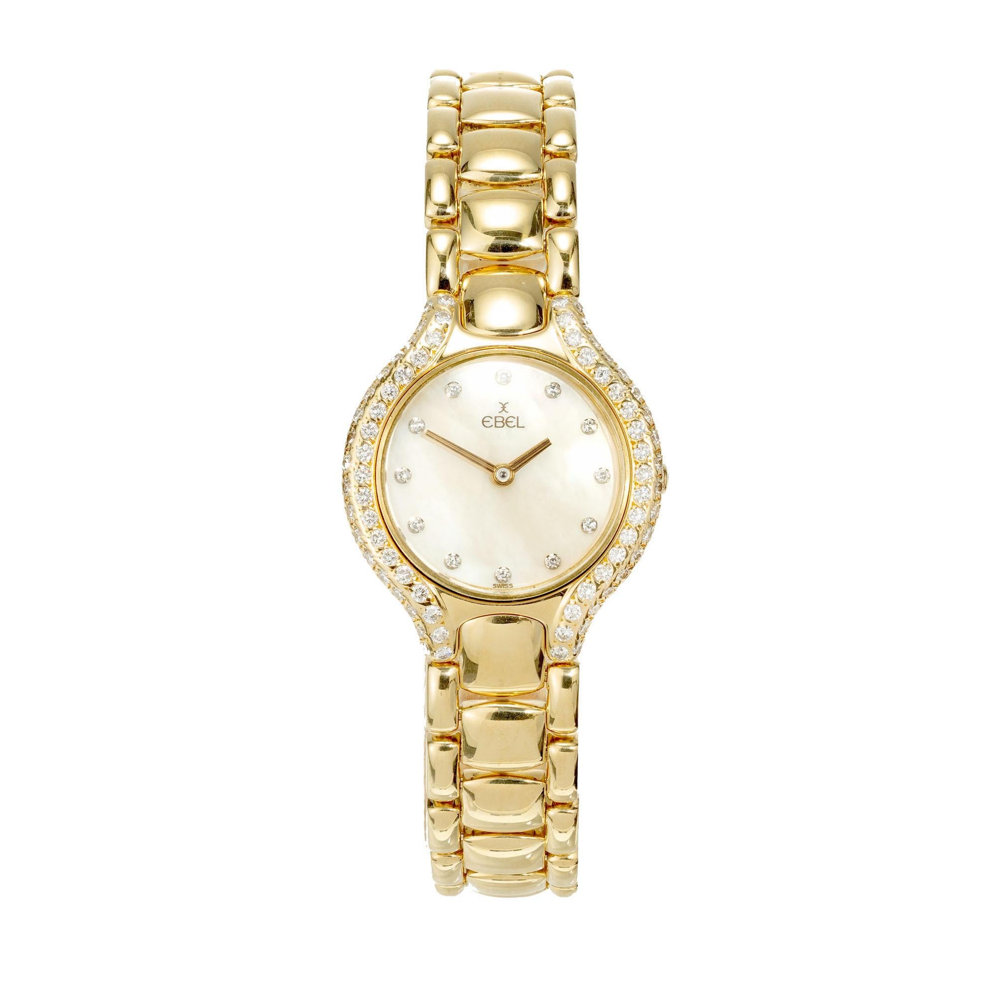 Ladies Ebel Beluga solid 18k yellow gold, diamond bezel and case rim, cream mother of pearl diamond dial.

Approx. 86 round diamonds
Length: 28mm
Width: 24.36mm
Band width at case: 11.98mm
Case thickness: 6.97mm
Band: 18k yellow gold 
Crystal: