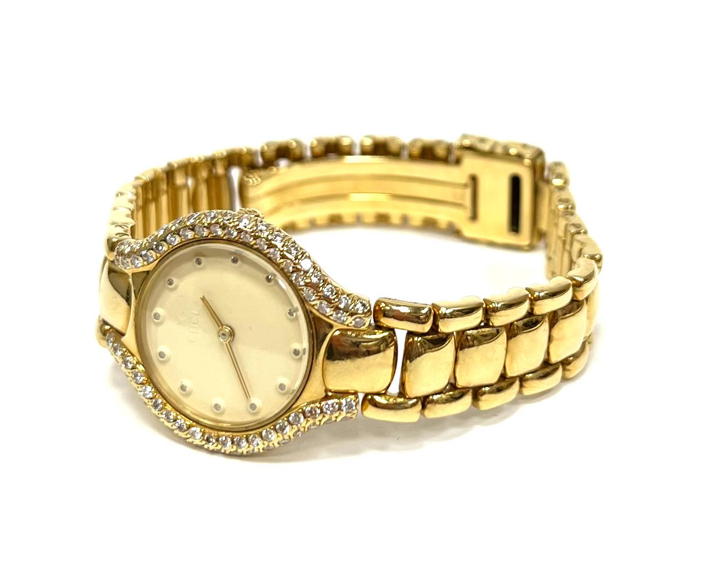 This is a beautiful  ladies wrist watch by Ebel in the Beluga design. The case and fancy link band is crafted from 18k yellow gold, white face with diamond hourmarkers and diamond bezel, all totaling 1 carat. Gold tone hands with sapphire crystal.