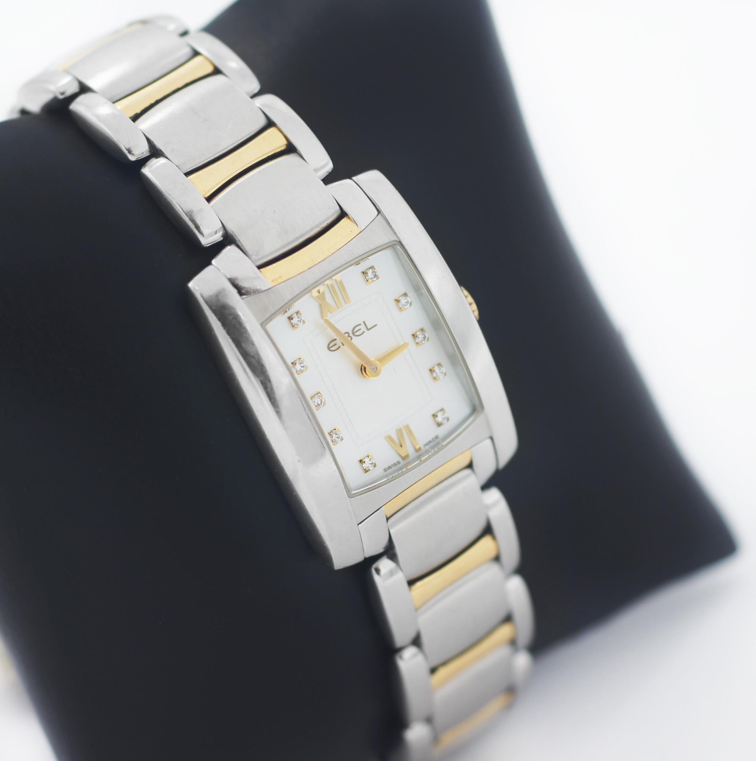 EBEL
Brasilia
Mini
Case Stainless Steel Rectangle
Approx. Case Dimensions 27mm X 30mm
Watch Material: Stainless Steel & Gold
Dial Color: Mother of Pearl with 10 Diamond markers
Gold hands and Roman numerals mark the 6 and 12 o'clock
