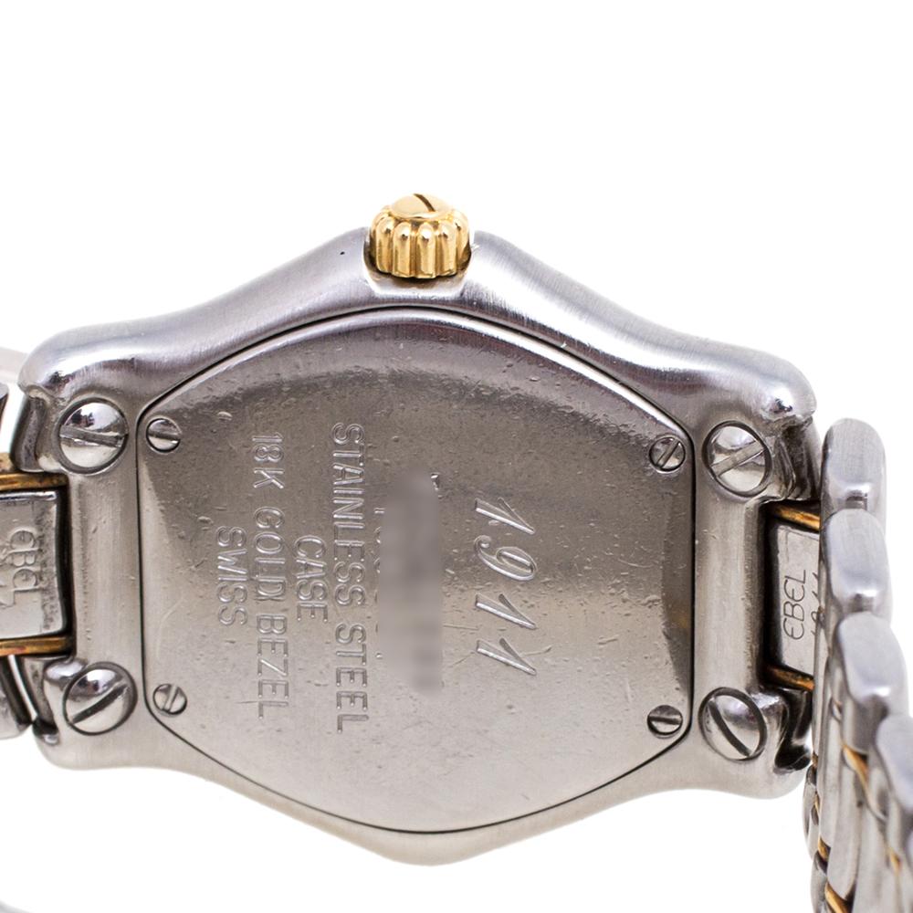 Classic and elegant, this Classic Wave wristwatch from Ebel is designed to complement your fashion taste with utmost subtlety. It has a stainless steel case with a screw-detailed 18k yellow gold bezel featuring a champagne dial having Roman numeral