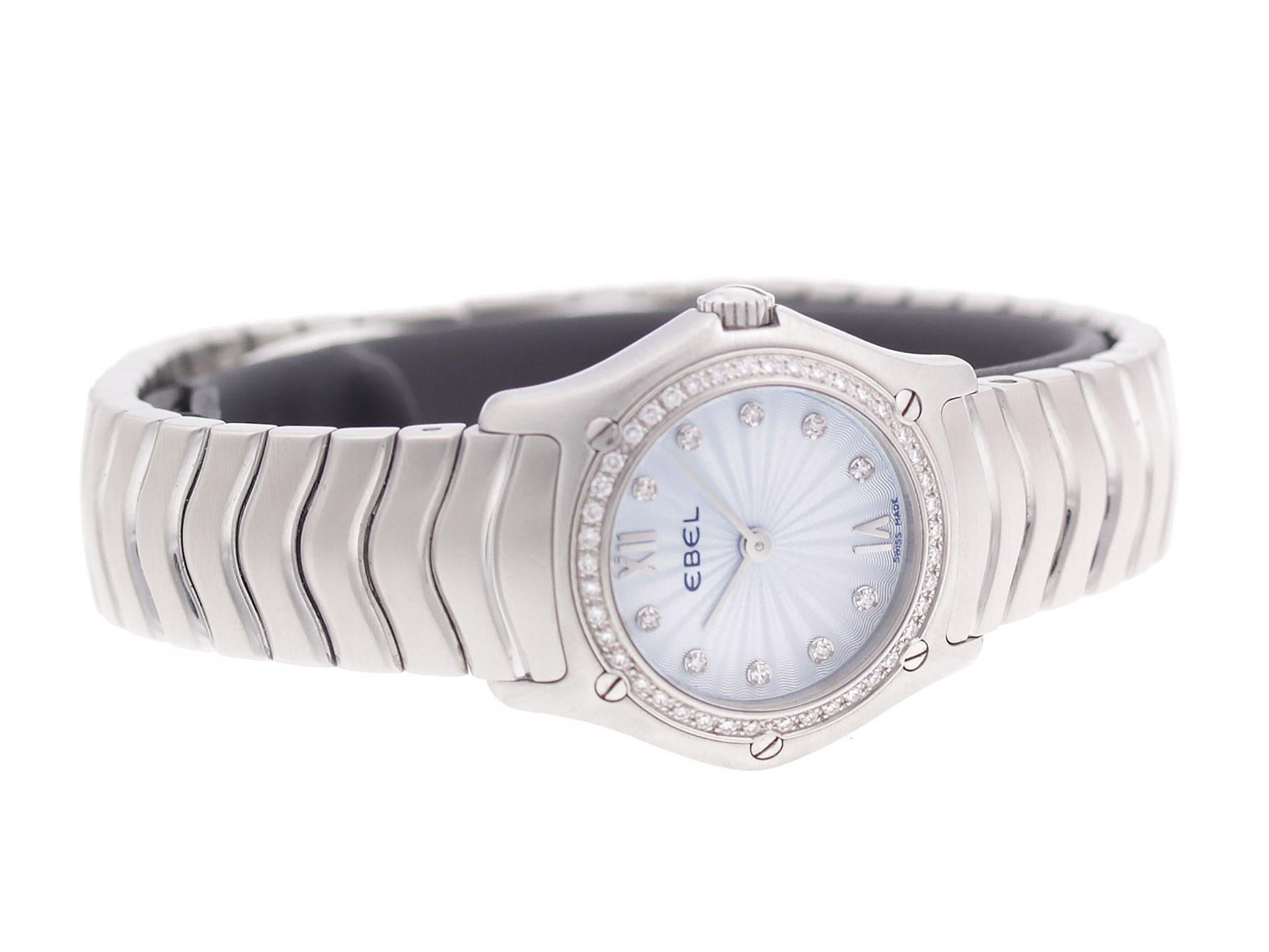 Stainless steel Ebel Classic Wave 9157F14-24725 watch, water resistance to 50m, with diamond bezel & indexes.

Watch	
Brand:	Ebel
Series:	Classic Wave
Model #:	9157F14-24725
Gender:	Ladies’
Condition:	Great Pre-owned, Tiny Dings and Light Scratches