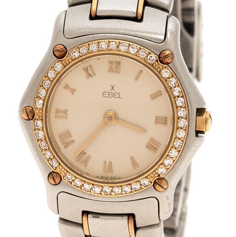 Fashioned in a stainless steel body, this Ebel wristwatch comes with a case diameter of 24mm. It features a rounded white dial detailed with gold-tone Roman numerals and hands. It comes fitted with a bracelet strap with yellow gold accents on it and