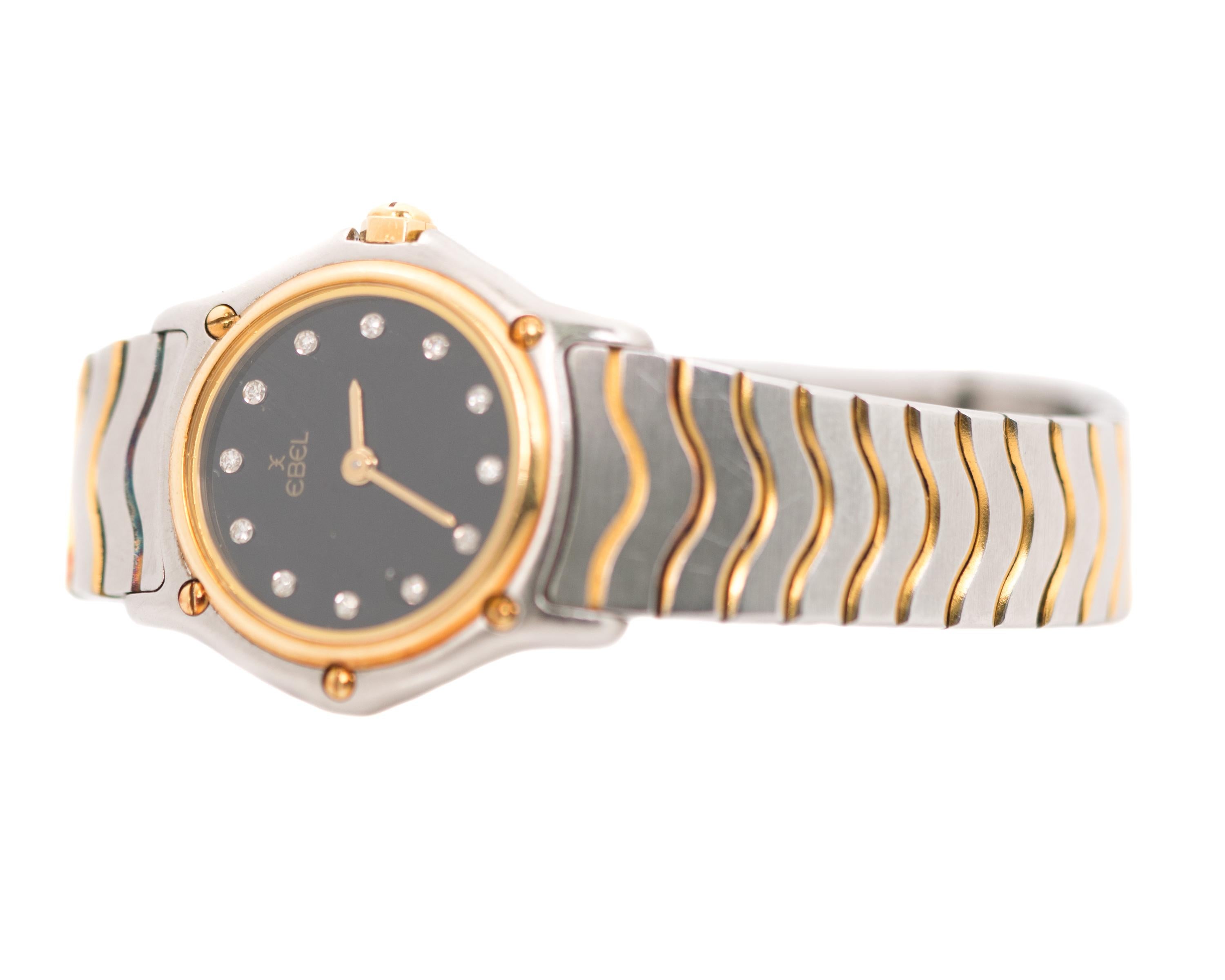 1990s Ebel Ladies Diamond Wrist Watch Classic Wave- 18 karat Yellow Gold, Stainless Steel, Diamonds

Features:
Reference #1057901
Diameter: 23 millimeters without crown, 25 millimeters with crown
Factory Diamond Dial
18 Karat Yellow Gold Bezel
Black