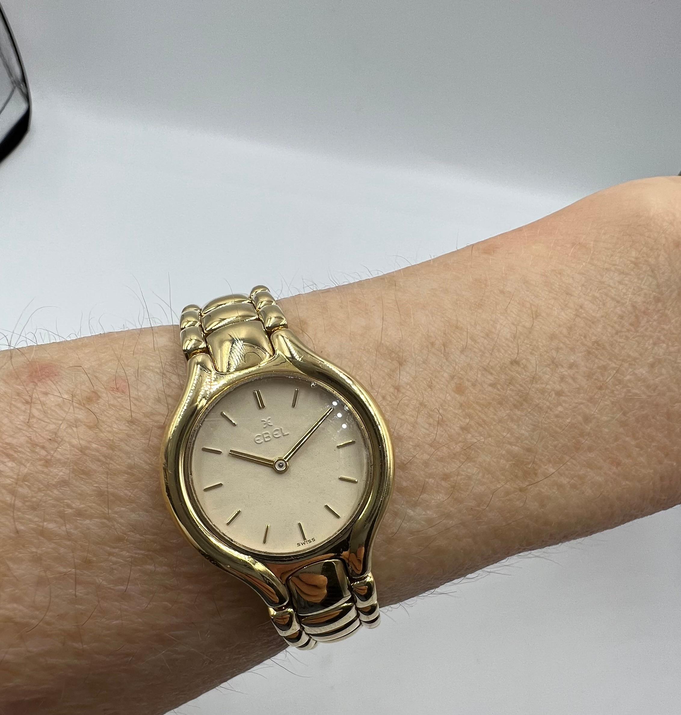 Pre-owned Ebel Beluga wristwatch, featuring a quartz movement; cream-colored dial with applied gold-toned hour indices; and 24mm, 18k yellow gold case on an 18k yellow gold link bracelet. Reverse of case marked 
