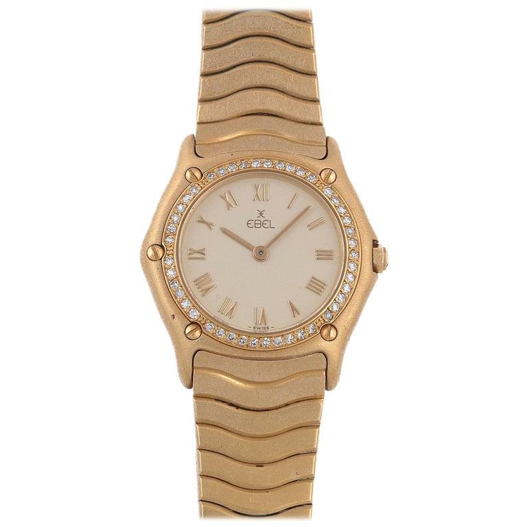 Discovery, 1990s
Jeweled quartz movement, champagne dial with applied Roman numbers, baton hands, tonneau shape case with diamond set bezel secured by five screws, on fitted 18k gold wave link bracelet with concealed folding buckle, dial signed