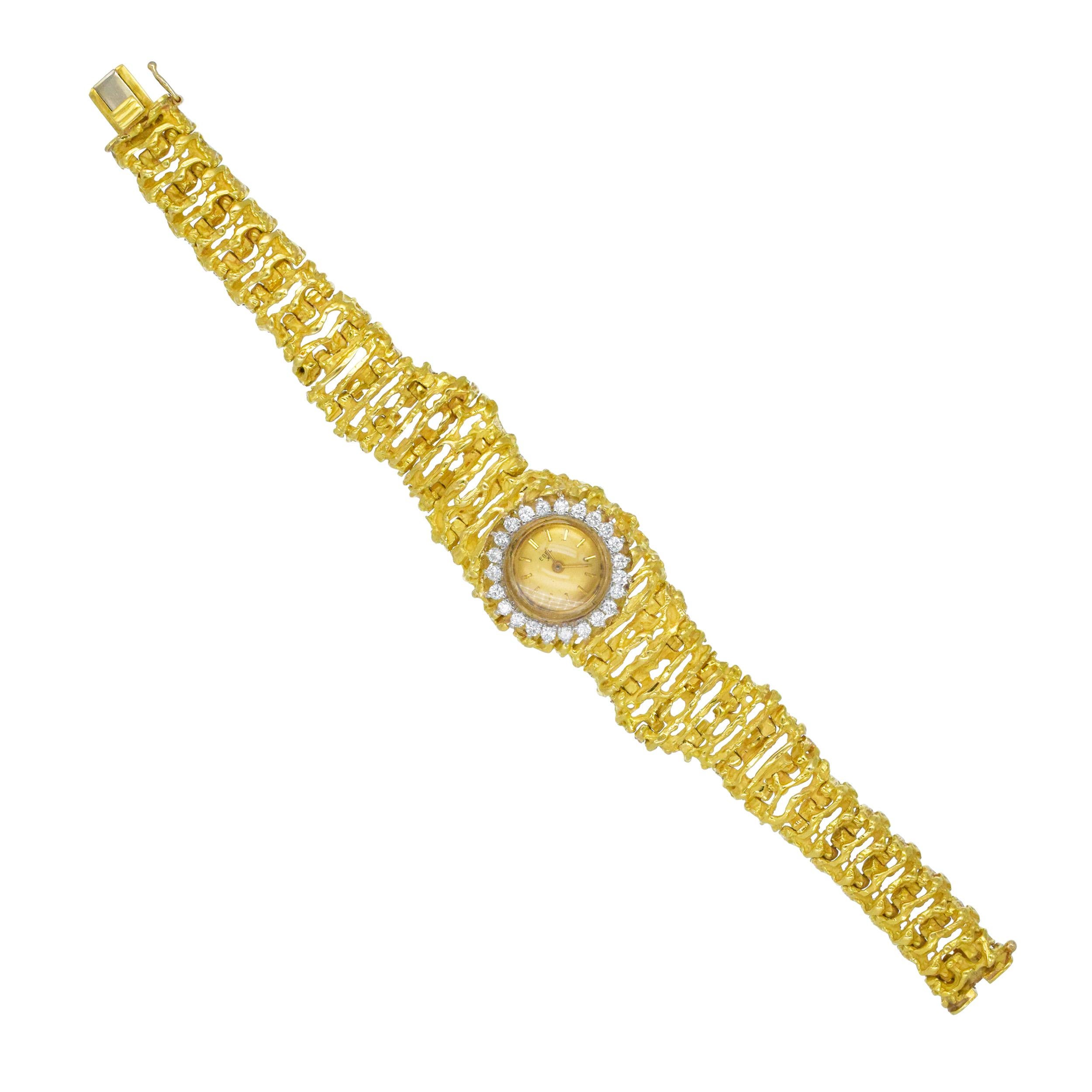 Reloj de pulsera Ebel Lady de oro y diamantes en oro amarillo de 18 quilates. Movimiento mecánico. El reloj tiene una esfera circular dorada con marcadores de bastón. Marca firmada  Ebel. Medidas del diámetro de la caja
aproximadamente 16 mm. Bisel