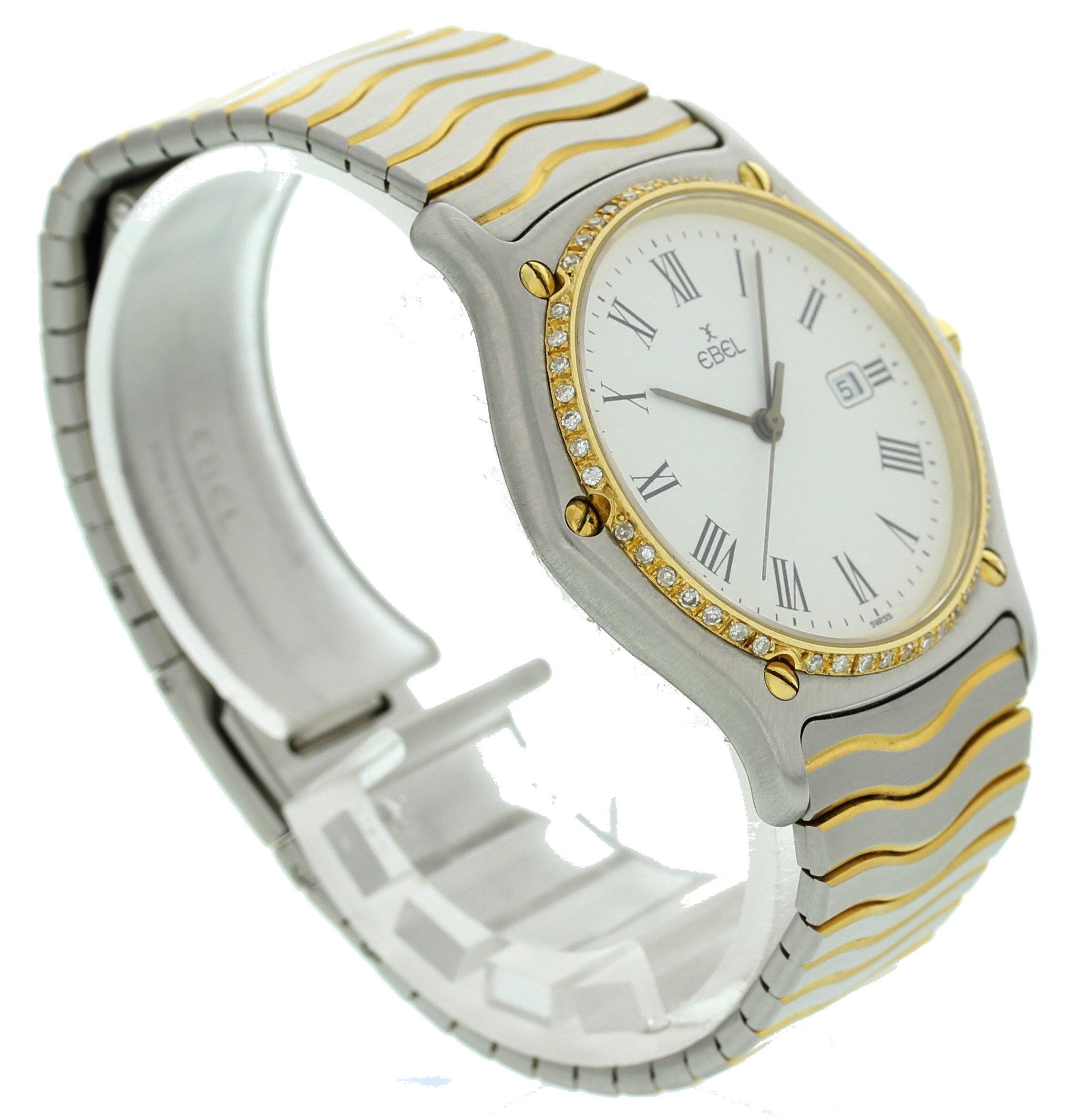 Unisex Ebel Sportswave 183903. 34 mm stainless steel case. 18K yellow gold bezel with custom set diamonds. Yellow gold dial with black hands and Roman numeral markers. Features a date display. 18K yellow gold & stainless steel band with hidden