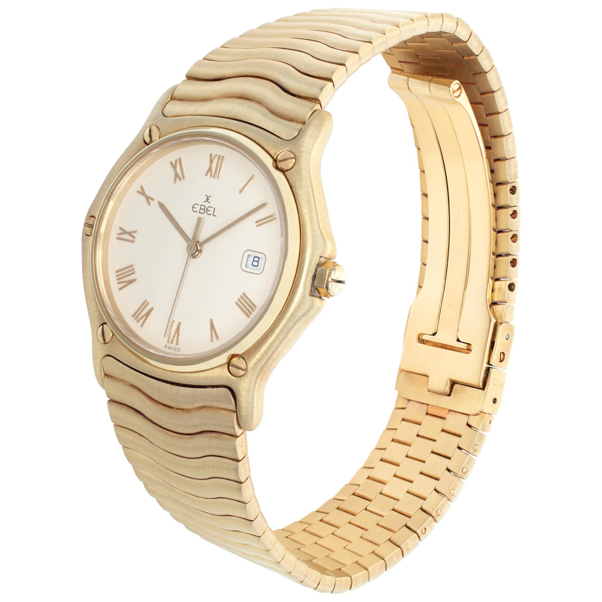 Ebel Sportwave in 18k yellow gold with cream dial set with yelow gold applied Roman numerals. Quartz w/ sweep seconds and date. 31 mm case size. Ref 883909. Fine Pre-owned Ebel Watch. Certified preowned Dress Ebel Sportwave 883909 watch is made out
