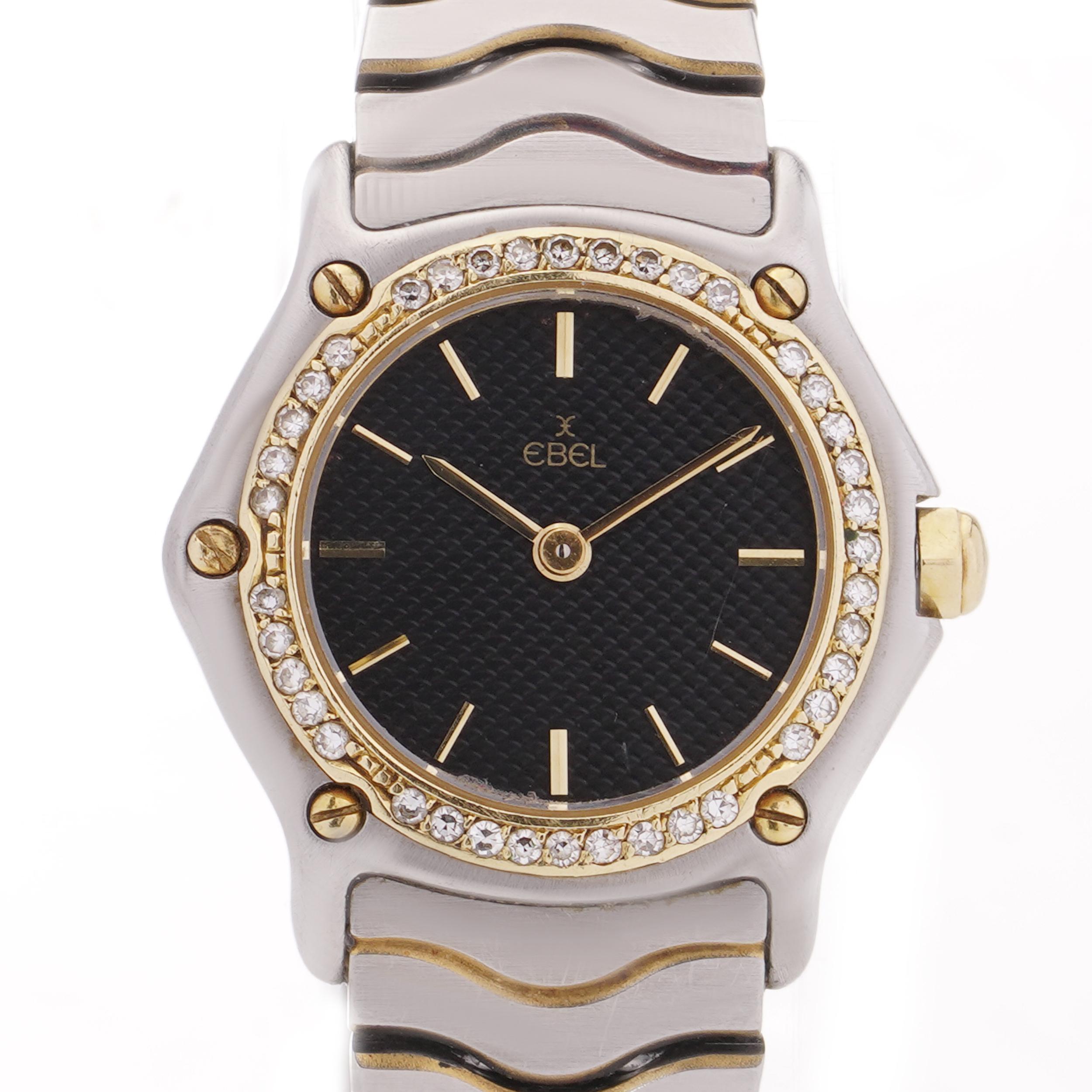 Ebel stainless steel and 18kt gold women's sports watch with round brilliant diamonds.

Year: 1980's
Model: Sports watch 
Ref: 166902-X,
Case Size: 22 mm 
Movement: Quartz
Dial colour: black 
Case Material: 18kt gold , stainless steel, diamonds