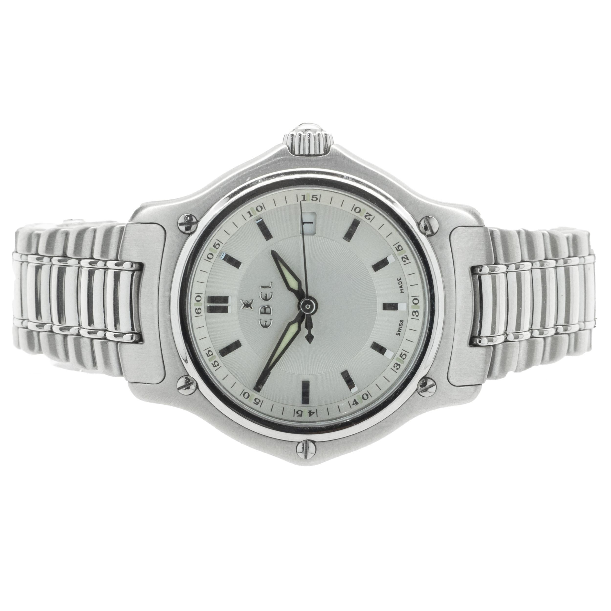 Movement: quartz
Function: hours, minutes, seconds, date
Case: 30mm stainless steel round case 
Band: Ebel stainless steel link bracelet
Dial: silver stick dial
Serial: 72507XXX

Complete with original box, no papers
Guaranteed to be authentic by