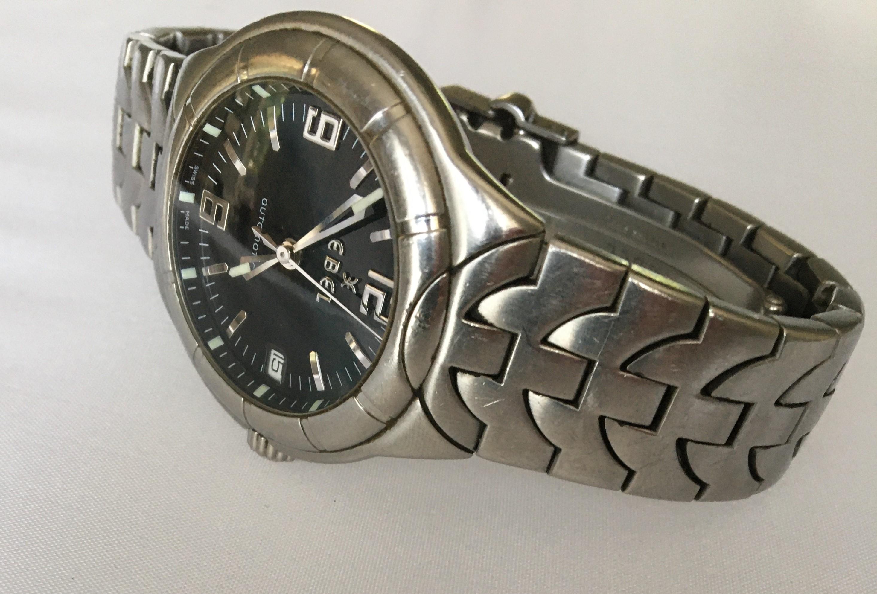 By luxury watch designer Ebel.
Brushed stainless steel bracelet, bracelet links resemble the Ebel 
