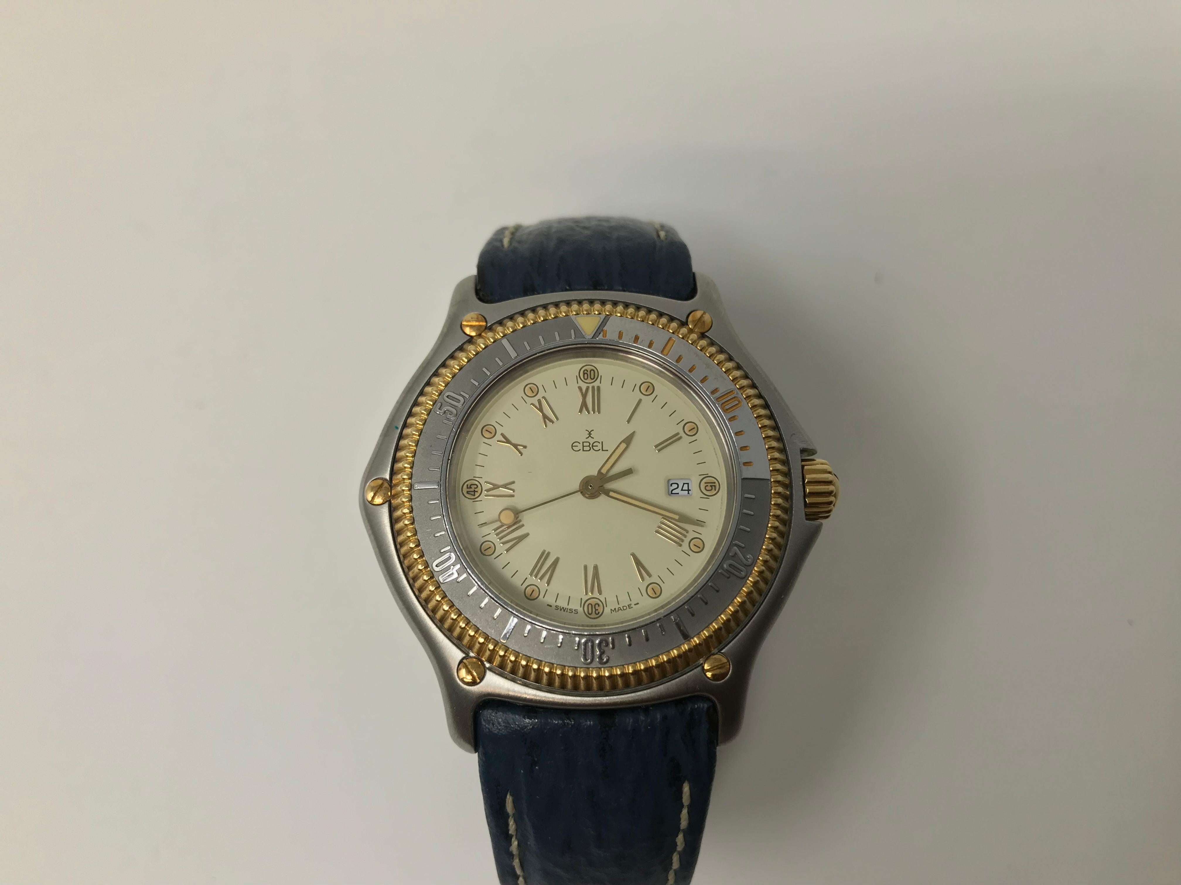 Stainless and 18k gold Ebel discovery diver's watch, 200 to 660 feet water resistant with 18k gold crown and coin edge bezel. Date at 3, case 38mm, quartz movement, leather strap. Working order