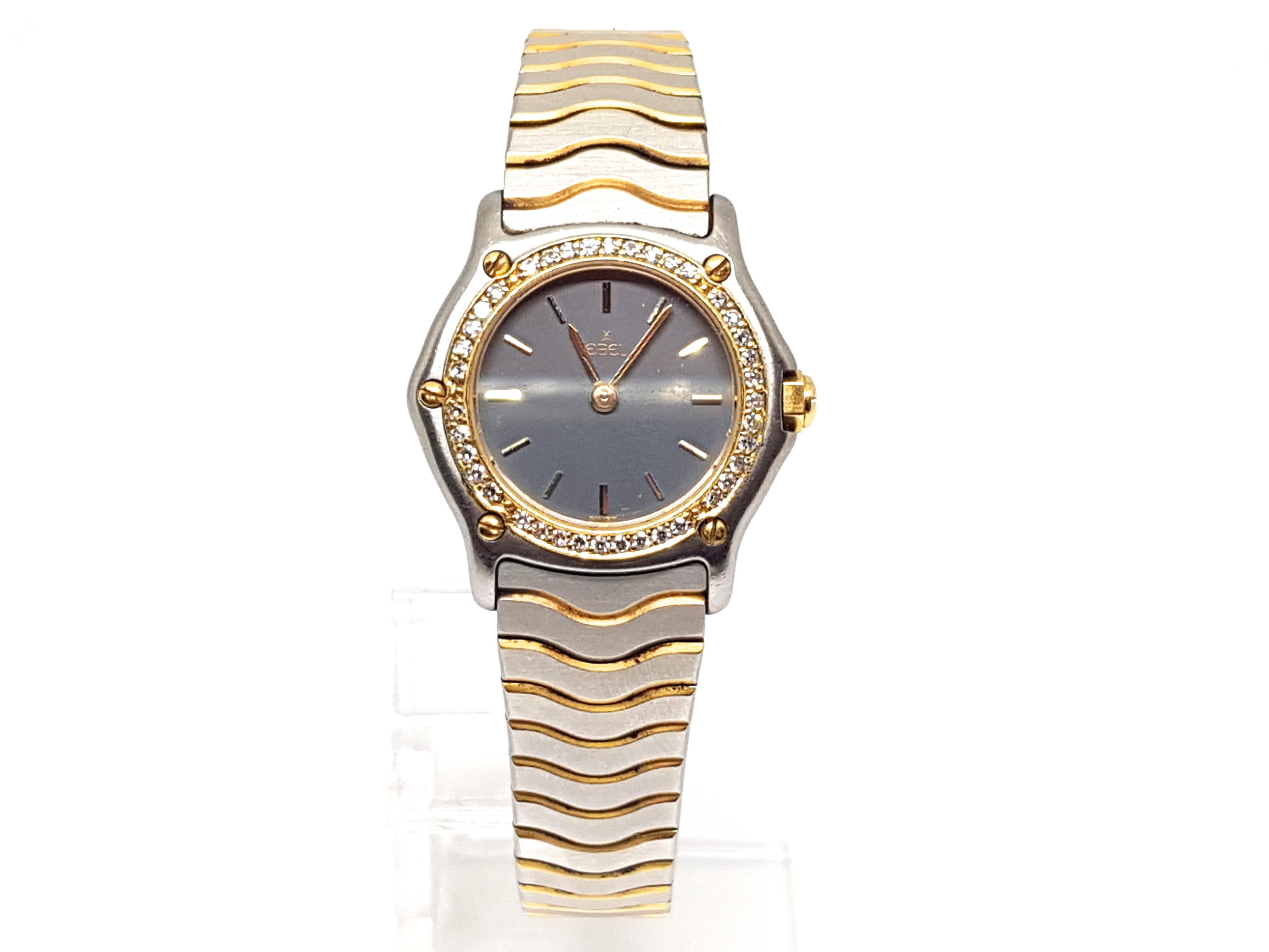 Signed Ebel Stainless Steel Case 18K Gold Bezel 11675921 1057902 
Quartz 
18 K Yellow Gold & Stainless Steel 
Total Weight: 38.55gr. 
Diameter: 26mm 
length: 17.5cm. 
Age: 2000-2010 
All our jewellery is hallmarked and comes with a certificate and a