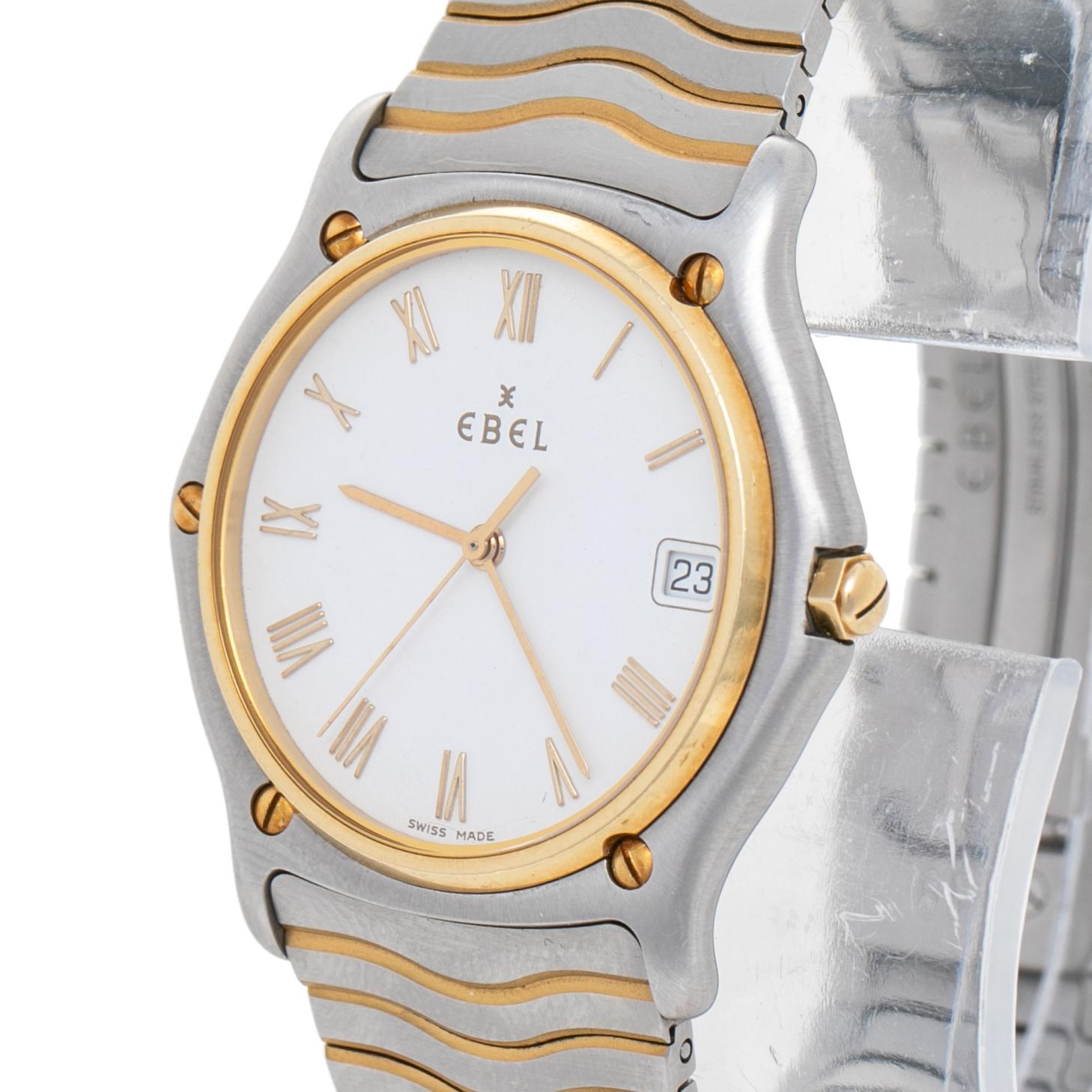 Classic and elegant, this Classic Wave wristwatch from Ebel is designed to complement your fashion taste with utmost subtlety. It has a stainless steel and 18k yellow gold case with a screw-detailed bezel featuring a white dial having Roman numeral