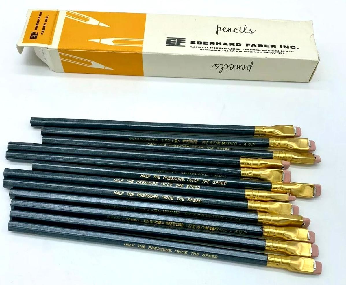 Eberhard Faber Blackwing 602 pencils, set of 12, original box, unsharpened 1960s. 

The Blackwing 602 is a pencil that is noted for its soft, dark graphite, unique flat square ferrule and replaceable eraser. It was manufactured by the Eberhard