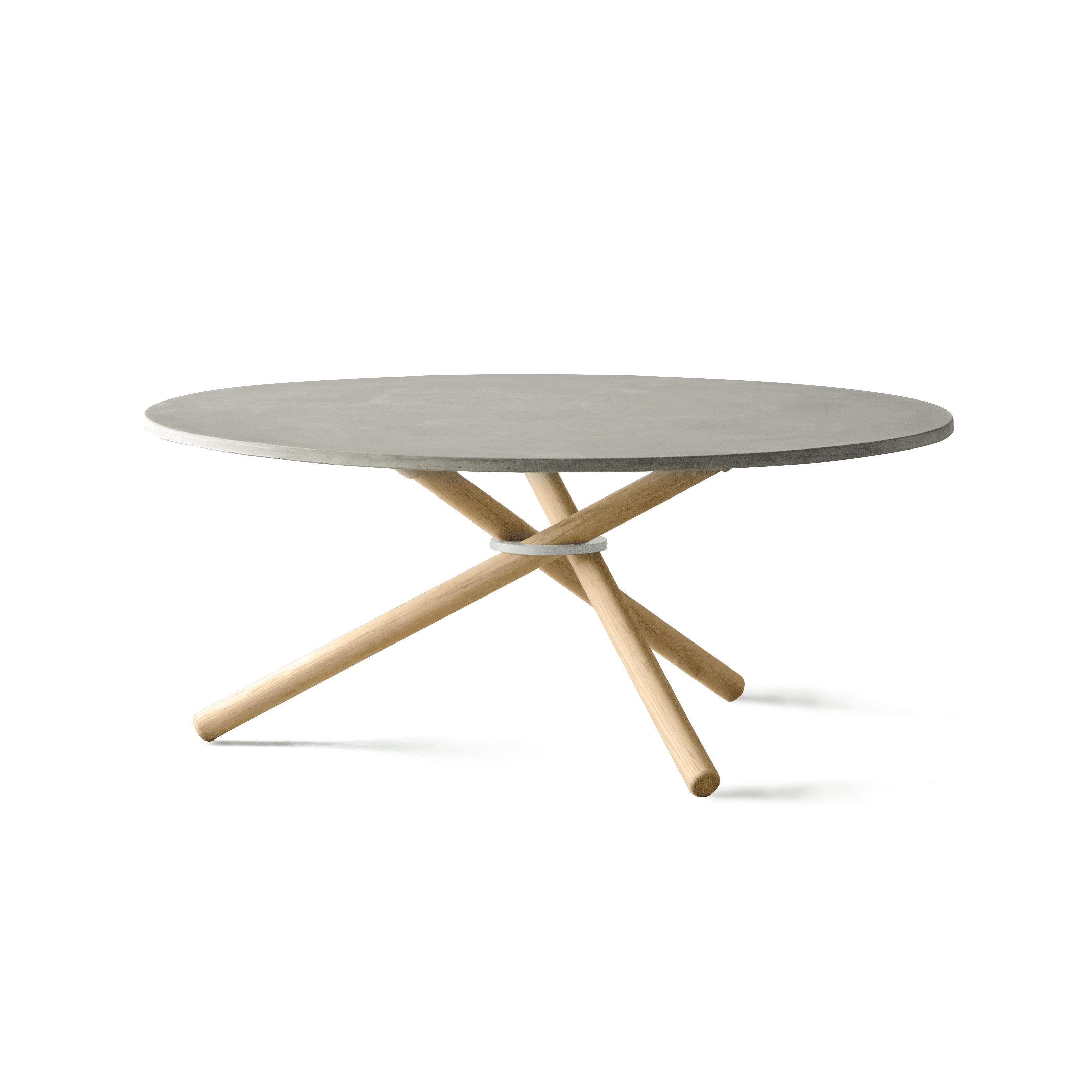 Bertha is a versatile and spacious coffee table. The table is constructed by three sub elements: The assembly ring, wooden legs and table top in either concrete, oak or birch. The almost floating table top and the sculptural impression of the legs,