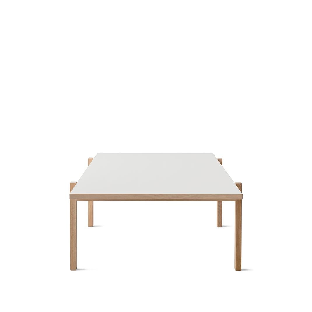 Eugene is a harmonious lounge and coffee table. The design is defined by simplicity and elegance, and the rectangular shape makes it easy to style. The coffee table is crafted in oak or birch with oak, birch or concrete tabletop allowing it to suit