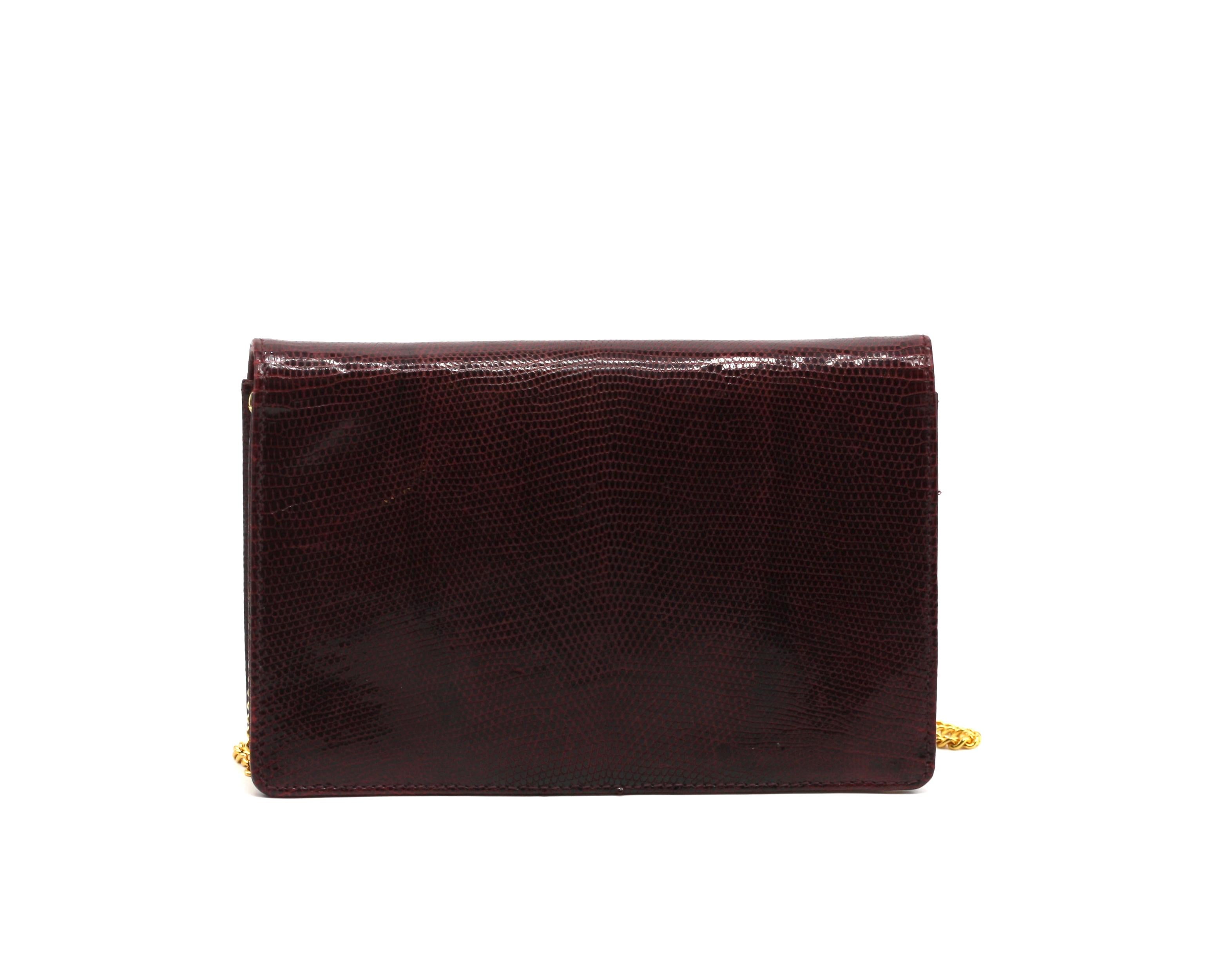 
Eberle Brazilian Snake Skin and Enamel Clutch
The burgundy snake skin exterior, the flap with a art Deco Style silvered metal red and black enamel closure plate, with burgundy leather interior, gold toned hardware, with chain link shoulder