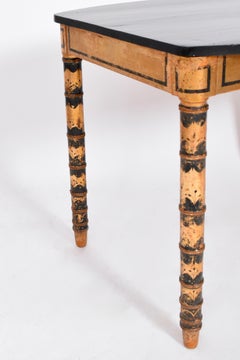 Ebonised and gold painted table, 1920s