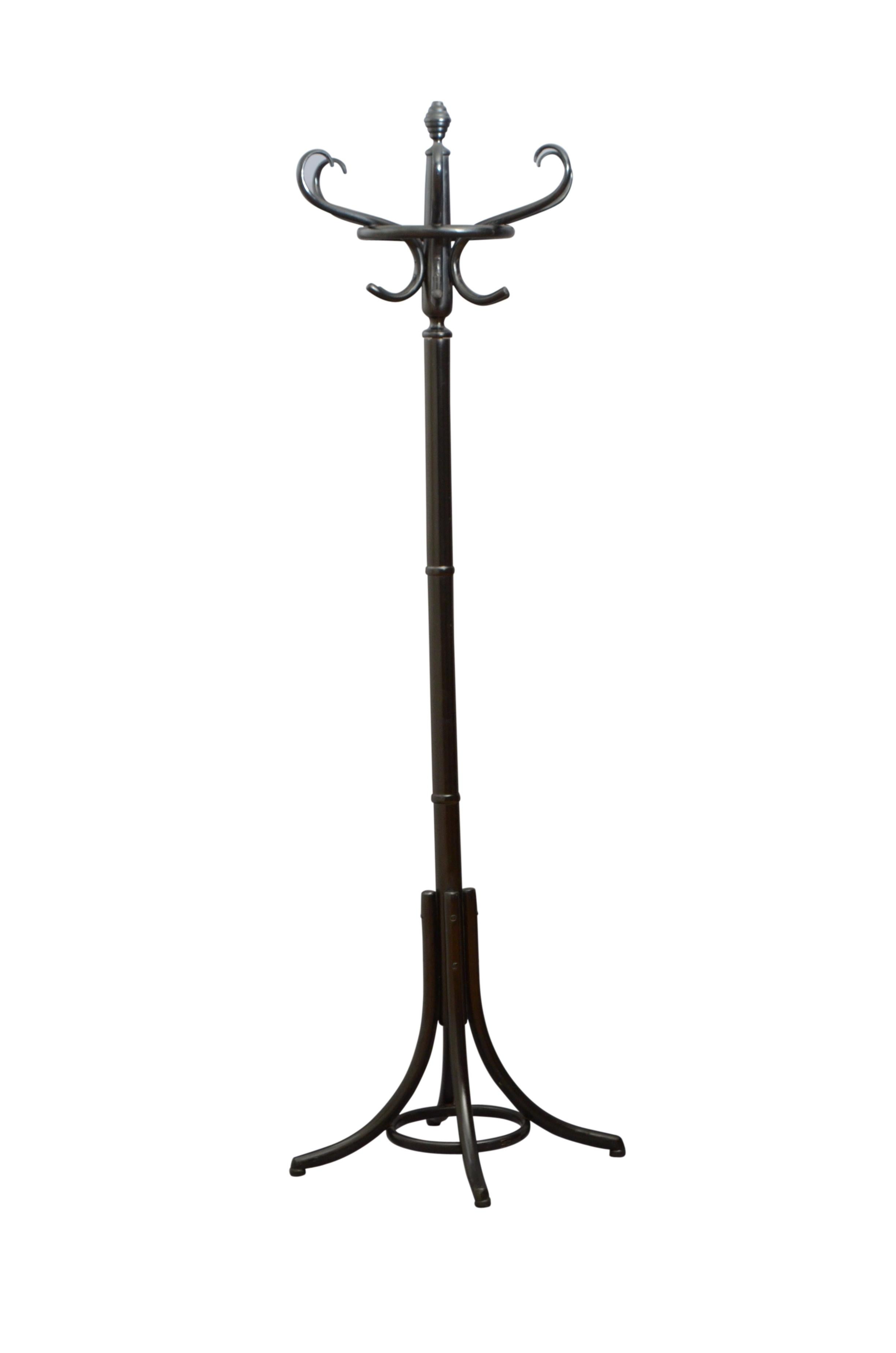 Stylish bentwood coat stand with beehive finial to the top, six scrolled hat and coat hooks and turned column terminating in four downswept legs. This antique coat stand is in excellent home ready condition. The hall stand bear a label Z P M