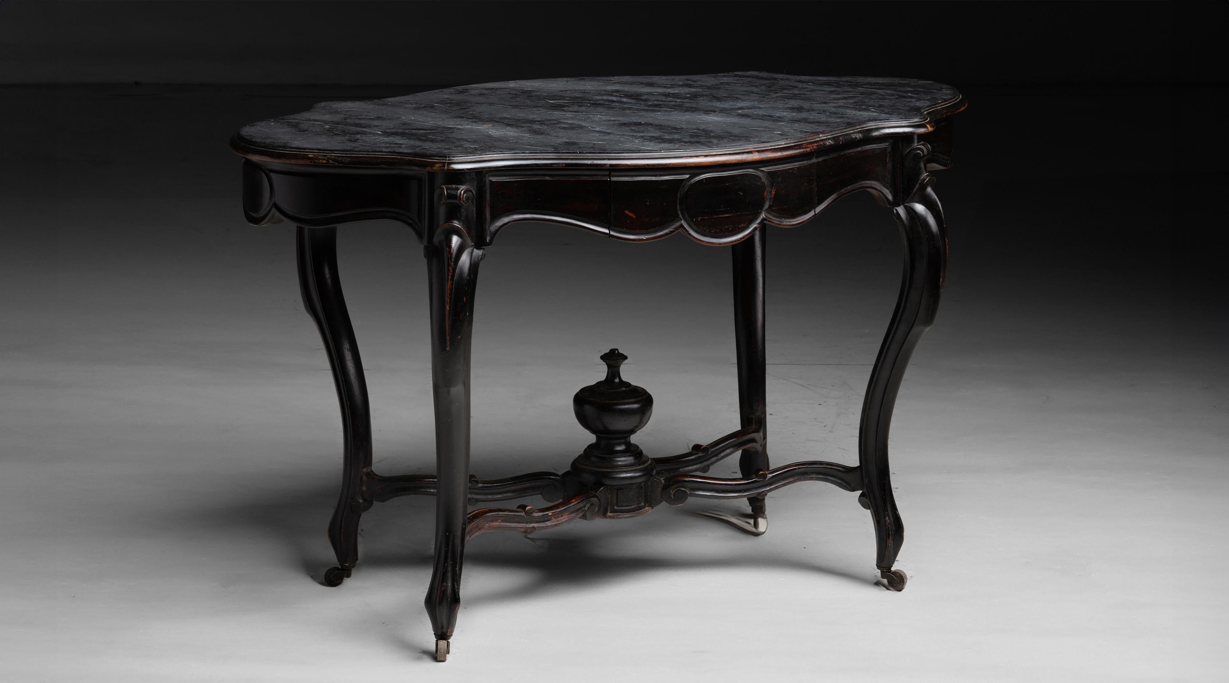 Ebonised Centre Table

France circa 1890

Ebonised mahogany with serpentine top with faux marble painted finish.

48”w x 27.5”d x 28.75”h
