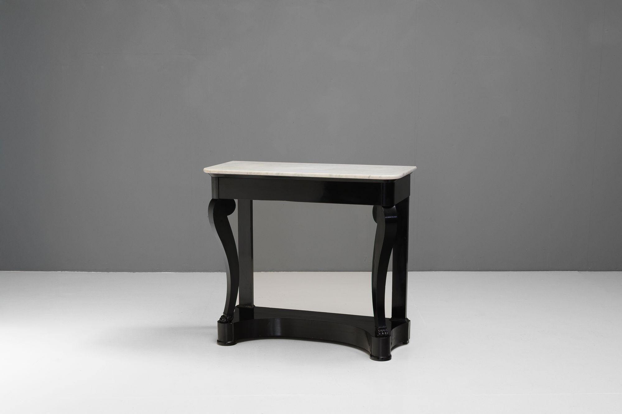 Ebonised marble console table with original white marble top (later ebonised).
France circa 1880.
H 89cm x W 97cm x D 41cm