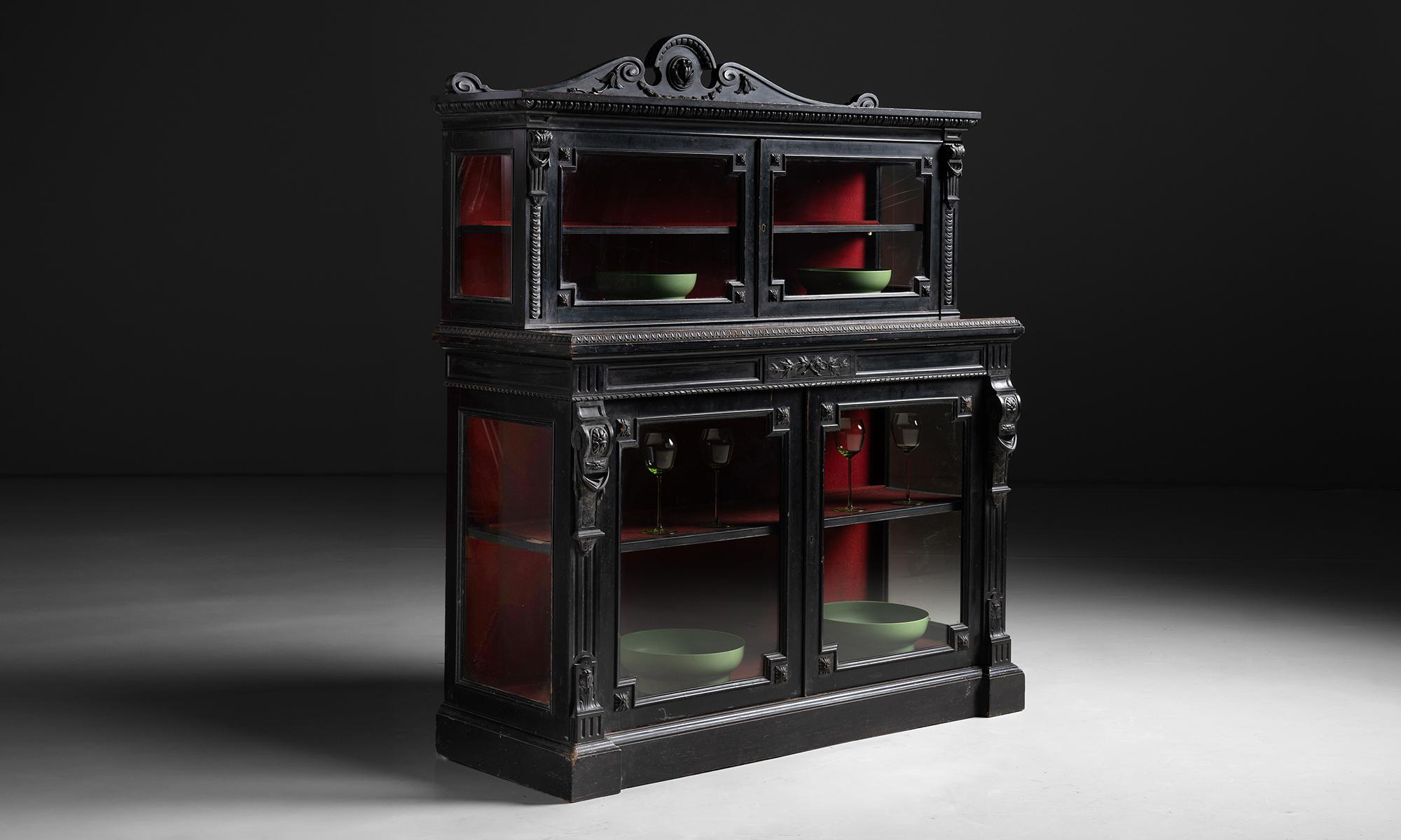 Ebonised & Glazed Cabinet

England circa 1830

Two tier cabinet with beautiful carved details and red baize interior.

Measures 51.25”w x 19.5”d x 60.75”h