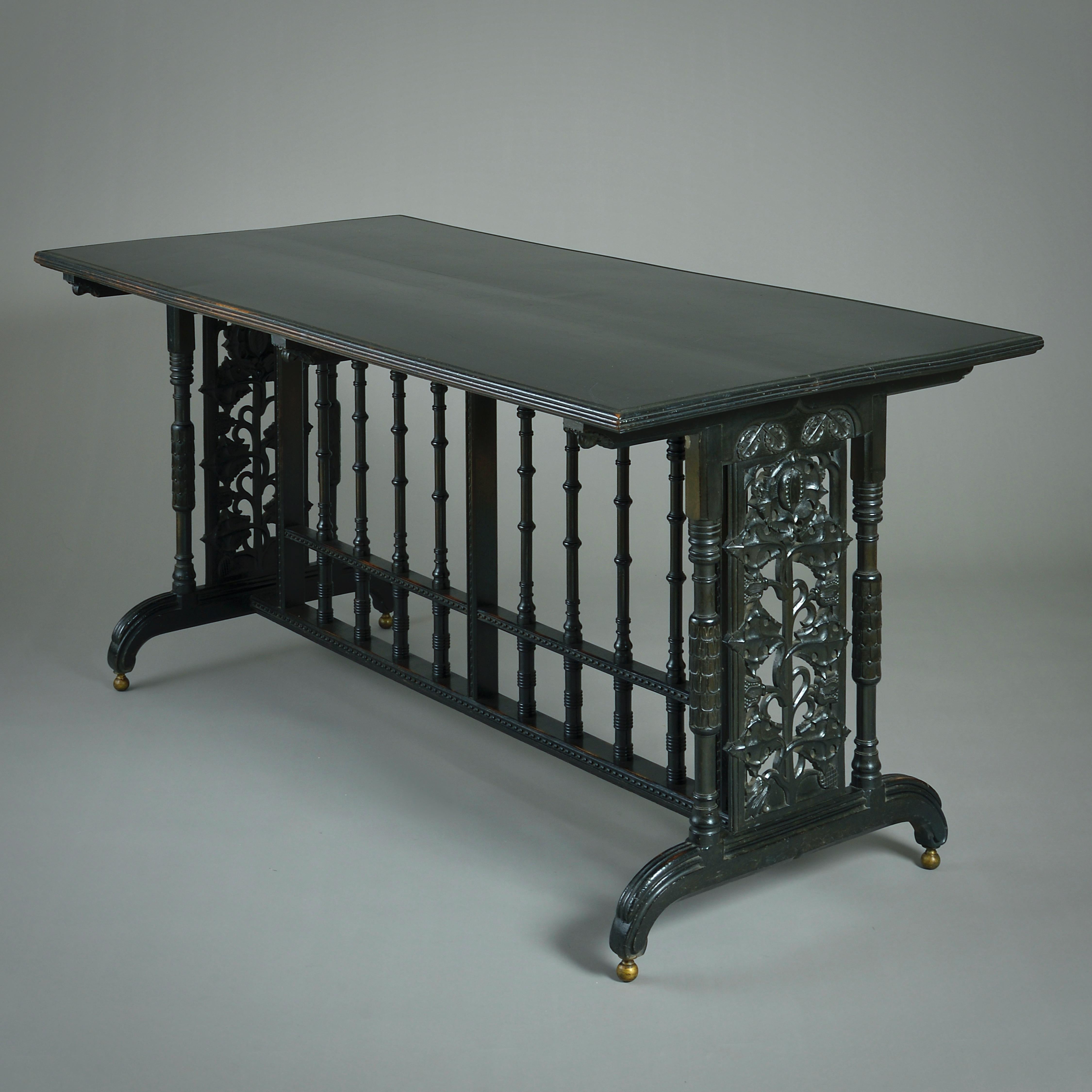 A VERY FINE EBONISED LIBRARY / WRITING-TABLE DESIGNED BY JOHN FRANCIS BENTLEY, CIRCA 1870.
Designed by the architect John Francis Bentley (1839-1902) for Sunnydene, Rockhills, Sydenham.

PROVENANCE: supplied to W. R. Sutton, Sunnydene, Sydenham, c.