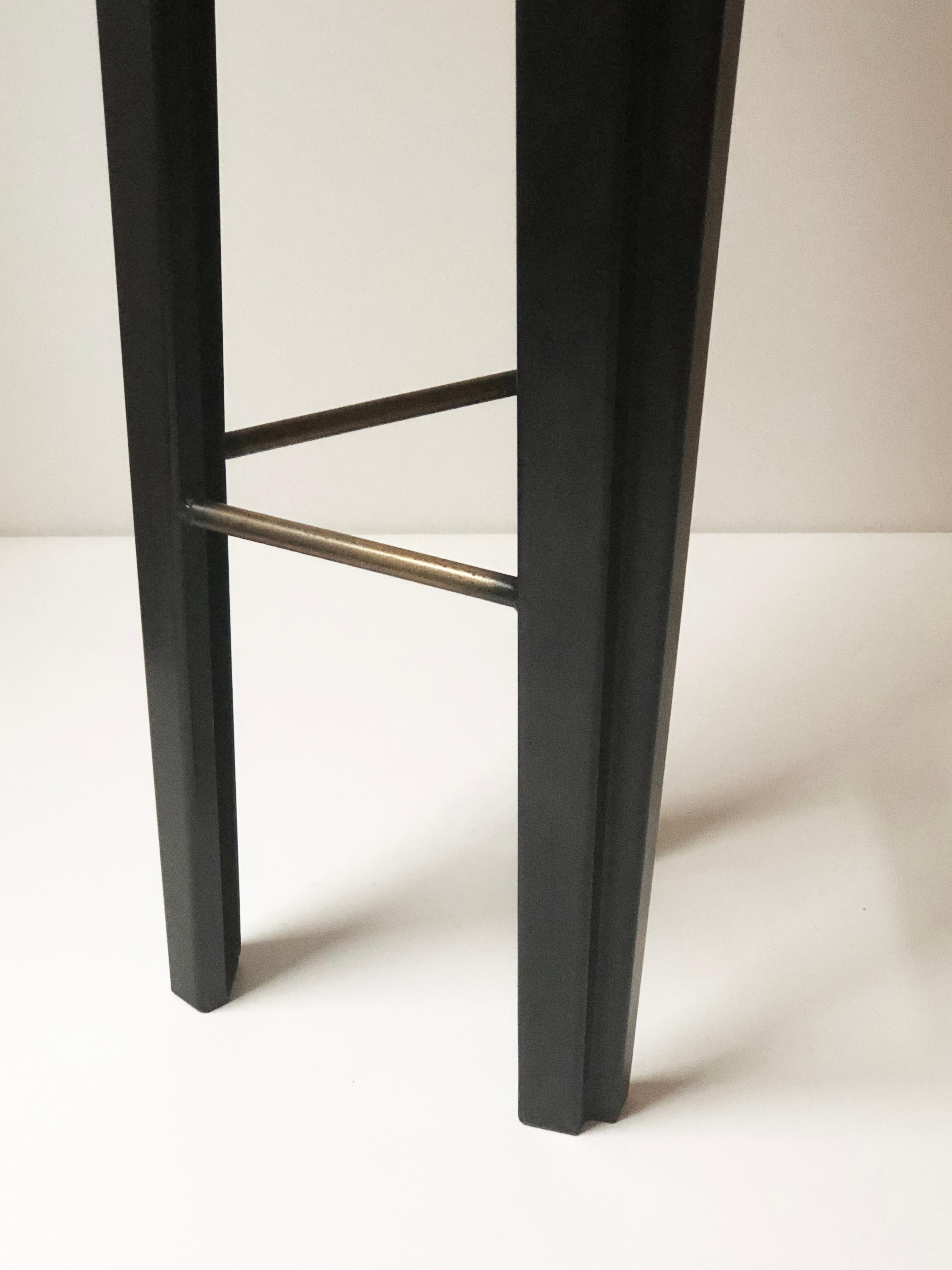 Ebonized oak bar stool signed by Cal Summers
Materials: Ebonized oak, blackened steel
Steel insert with bronze finish
Dimensions: 12 1/2”D x 12 1/2”W x 29”H

Cal Summers is a British designer who makes bespoke handmade furniture and