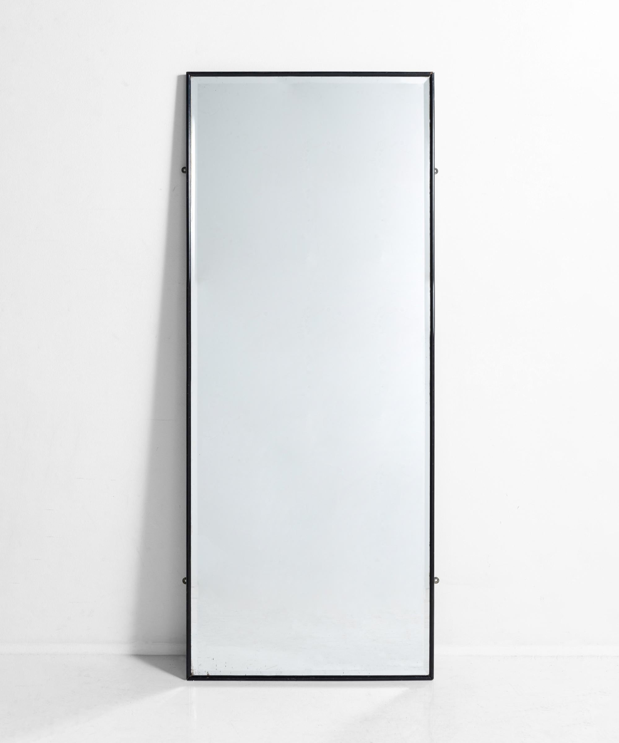 Ebonized outfitters wall mirror, England, circa 1880.

Originally used in a men’s clothing shop in Leicestershire, with original beveled edge mirror plate.

Measures: 24.75” W x .75” D x 60.5” H.
